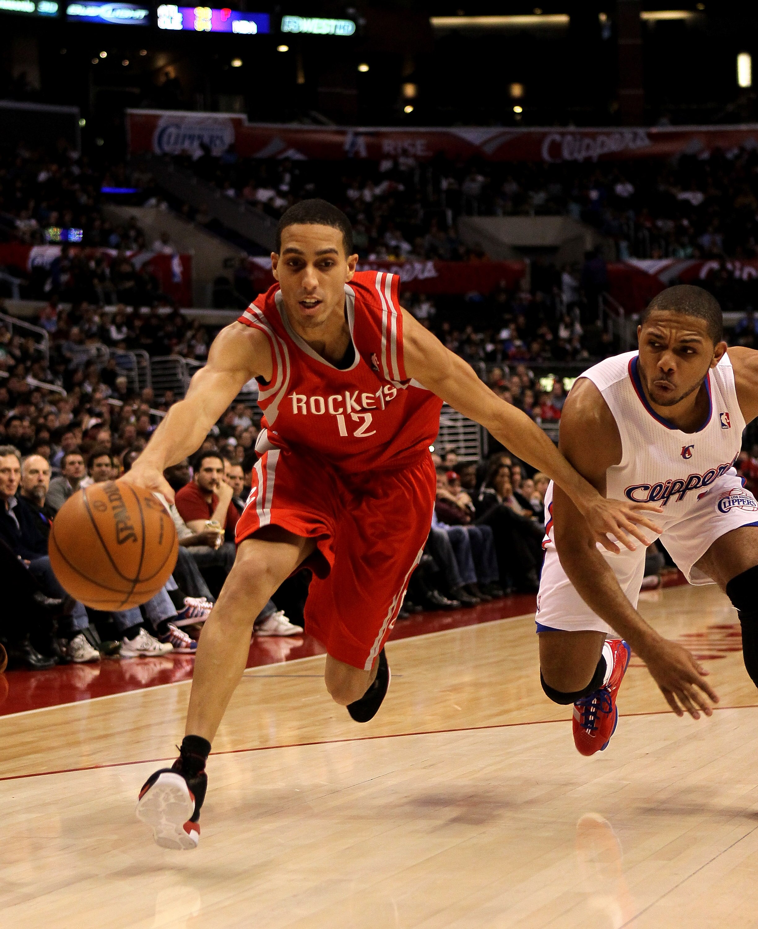 LOS ANGELES, CA - DECEMBER 22:  Kevin Martin #12 of the Houston Rockets reaches to control the ball in front of Eric Gordon #10 of the Los Angeles Clippers at Staples Center on December 22, 2010 in Los Angeles, California.  NOTE TO USER: User expressly ac