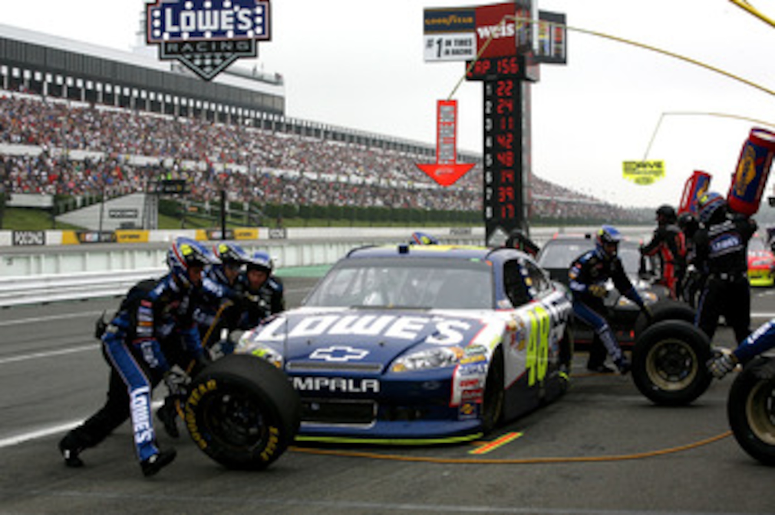 LONG POND, PA - JUNE 12:  Jimmie Johnson, driver of the #48 Lowe's Chevrolet, pits during the NASCAR Sprint Cup Series 5-Hour Energy 500 at Pocono Raceway on June 12, 2011 in Long Pond, Pennsylvania.  (Photo by Jerry Markland/Getty Images for NASCAR)