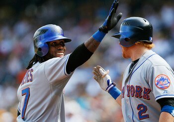 PITTSBURGH - JUNE 12:  Jose Reyes #7 of the New York Mets celebrates with teammate Justin Turner #2 after hitting a home run against the Pittsburgh Pirates during the game on June 12, 2011 at PNC Park in Pittsburgh, Pennsylvania.  (Photo by Jared Wickerha