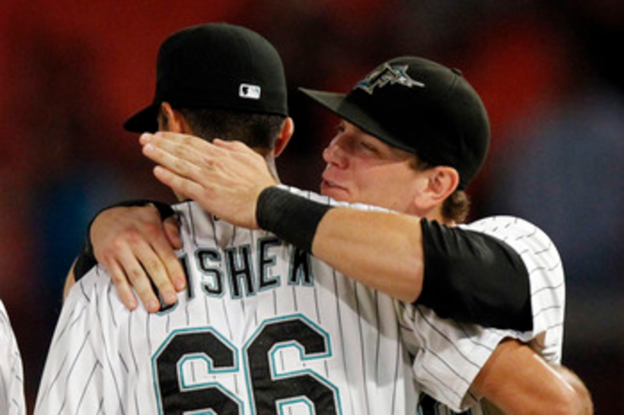 MIAMI GARDENS, FL - JUNE 10: Pitcher Steve Cishek #66 of the Florida Marlins celebrates a 6-4 win with teammate Logan Morrison #20 against the Arizona Diamondbacks at Sun Life Stadium on June 10, 2011 in Miami Gardens, Florida. (Photo by Eliot J. Schechte MIAMI GARDENS, FL - JUNE 10: Pitcher Steve Cishek #66 of the Florida Marlins celebrates a 6-4 win with teammate Logan Morrison #20 against the Arizona Diamondbacks at Sun Life Stadium on June 10, 2011 in Miami Gardens, Florida. (Photo by Eliot J. Schechte