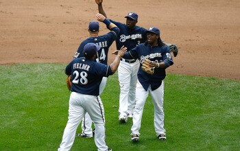 MILWAUKEE, WI - JUNE 12: Prince Fielder #28 of the Milwaukee Brewers celebrates the win with Rickie Weeks #23, Casey McGehee #14 and Yuniesky Betancourt #3 against the St. Louis Cardinals at Miller Park on June 12, 2011 in Milwaukee, Wisconsin. The Brewer