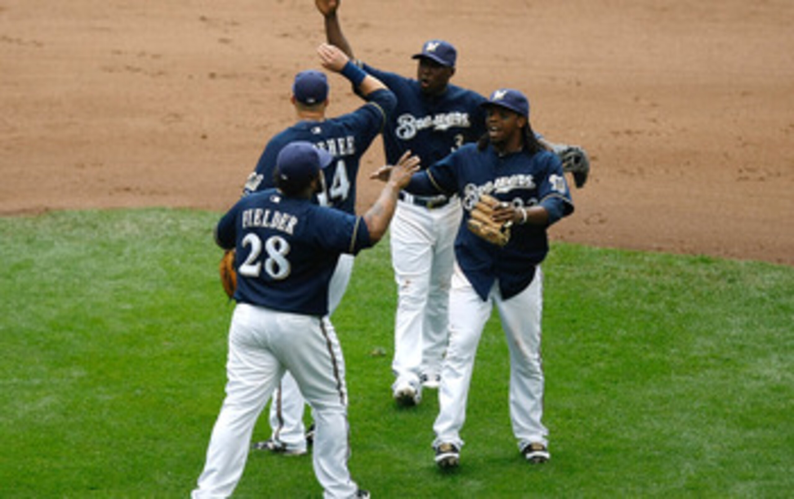 MILWAUKEE, WI - JUNE 12: Prince Fielder #28 of the Milwaukee Brewers celebrates the win with Rickie Weeks #23, Casey McGehee #14 and Yuniesky Betancourt #3 against the St. Louis Cardinals at Miller Park on June 12, 2011 in Milwaukee, Wisconsin. The Brewer MILWAUKEE, WI - JUNE 12: Prince Fielder #28 of the Milwaukee Brewers celebrates the win with Rickie Weeks #23, Casey McGehee #14 and Yuniesky Betancourt #3 against the St. Louis Cardinals at Miller Park on June 12, 2011 in Milwaukee, Wisconsin. The Brewer