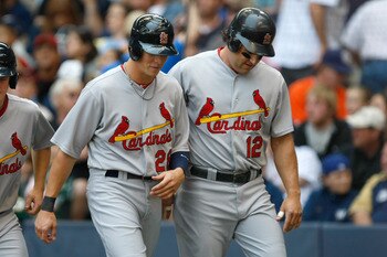 MILWAUKEE, WI - JUNE 12: Lance Berkman #12 of the St. Louis Cardinals talks with Colby Rasmus #28 after scoring a run against the Milwaukee Brewers at Miller Park on June 12, 2011 in Milwaukee, Wisconsin. (Photo by Scott Boehm/Getty Images)