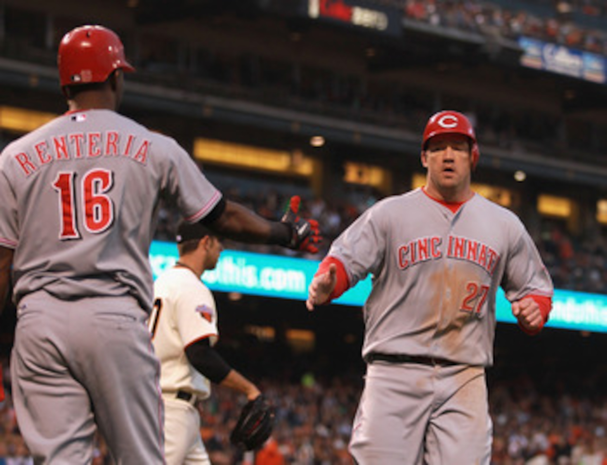 SAN FRANCISCO, CA - JUNE 09: Scott Rolen #27 of the Cincinnati Reds is congratulated by Edgar Renteria #16 of the Cincinnati Reds after he scored in the fourth inning against the San Francisco Giants at AT&T Park on June 9, 2011 in San Francisco, Califor SAN FRANCISCO, CA - JUNE 09: Scott Rolen #27 of the Cincinnati Reds is congratulated by Edgar Renteria #16 of the Cincinnati Reds after he scored in the fourth inning against the San Francisco Giants at AT&T Park on June 9, 2011 in San Francisco, Califor