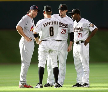 HOUSTON - JUNE 09:  (L-R) Lance Berkman #12 of the St. Louis Cardinals talks with former teammates Jeff Keppinger #8, Chris Johnson #23 and Michael Bourn #21 of the Houston Astros before the start of the game at Minute Maid Park on June 9, 2011 in Houston