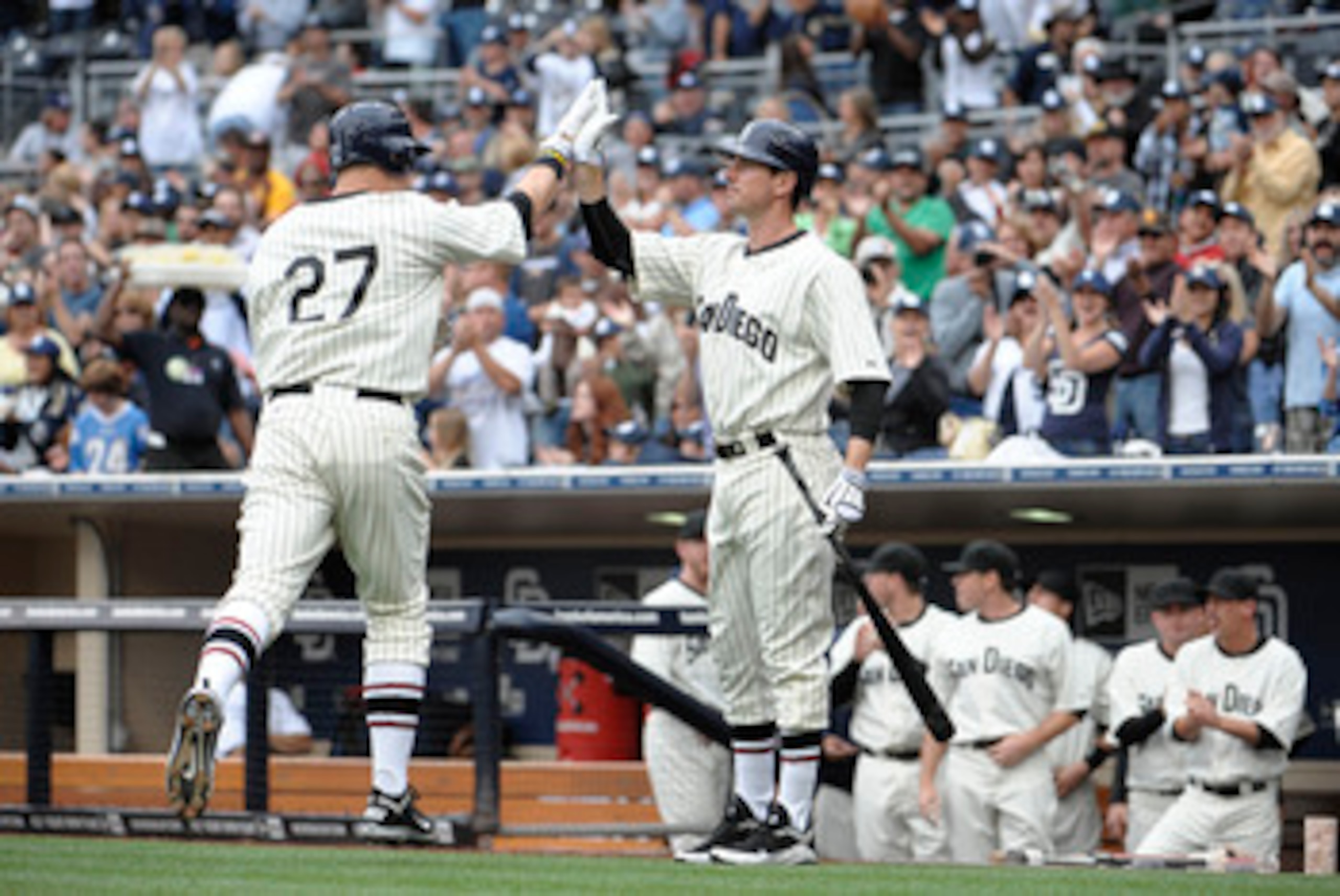 SAN DIEGO, CA - JUNE 11: Anthony Rizzo #27 of the San Diego Padres is congratulated by Brad Hawpe #11after hitting a solo home run during the second inning of a baseball game against the Washington Nationals at Petco Park on June 11, 2011 in San Diego, Ca SAN DIEGO, CA - JUNE 11: Anthony Rizzo #27 of the San Diego Padres is congratulated by Brad Hawpe #11after hitting a solo home run during the second inning of a baseball game against the Washington Nationals at Petco Park on June 11, 2011 in San Diego, Ca