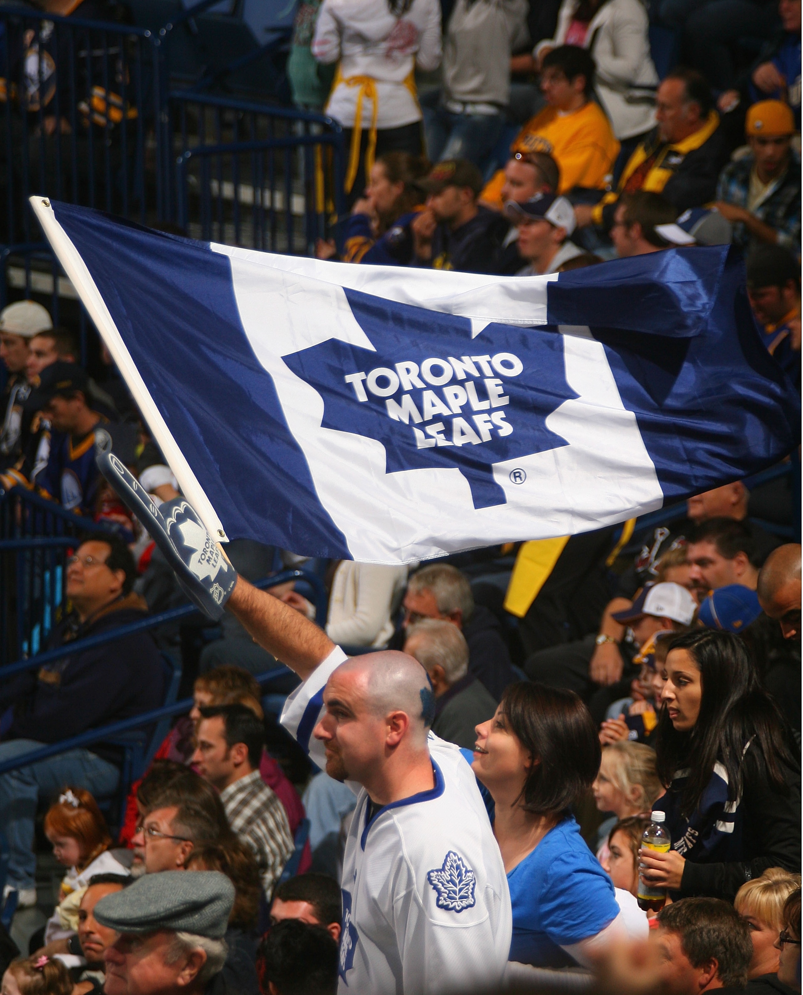 BUFFALO, NY - SEPTEMBER 25: Fans of the Toronto Maple Leafs wave a Maple Leaf flag while playing the Buffalo Sabres  at HSBC Arena on September 25, 2010 in Buffalo, New York.  (Photo by Rick Stewart/Getty Images)