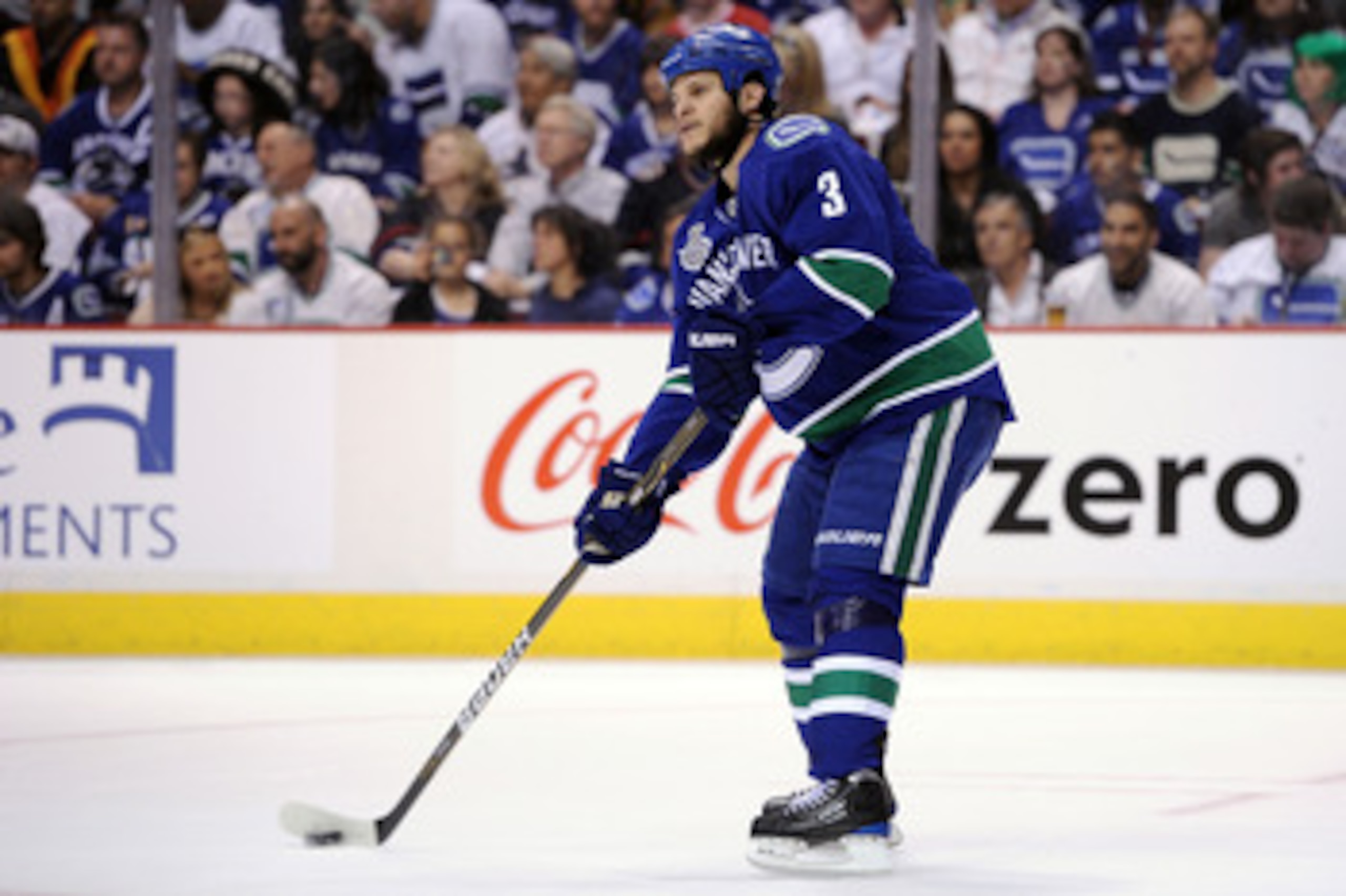 VANCOUVER, BC - JUNE 04:  Kevin Bieksa #3 of the Vancouver Canucks skates with the puck against the Boston Bruins during Game Two of the 2011 NHL Stanley Cup Final at Rogers Arena on June 4, 2011 in Vancouver, British Columbia, Canada.  (Photo by Harry Ho