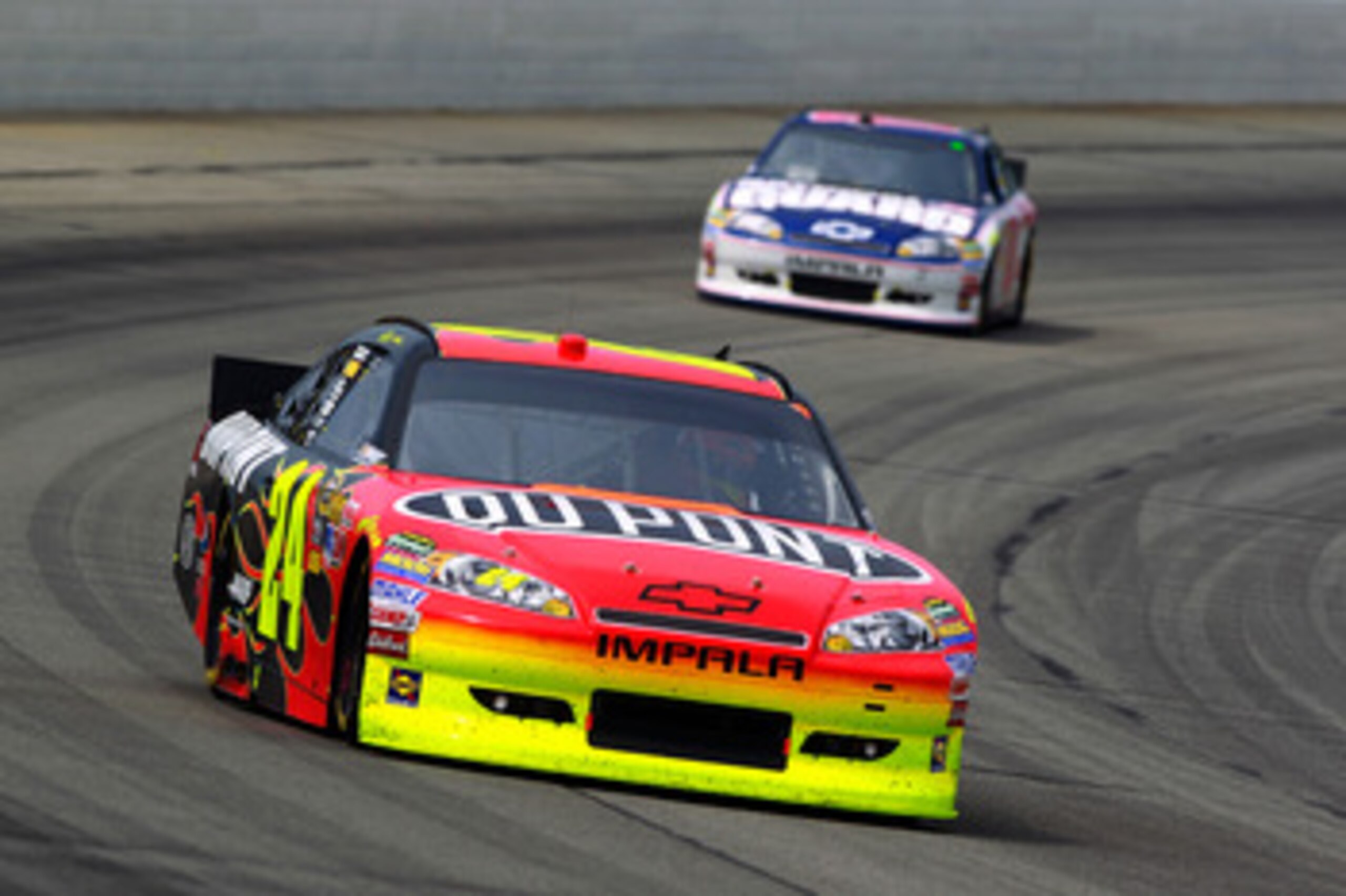 LONG POND, PA - JUNE 12:  Jeff Gordon, driver of the #24 DuPont Chevrolet, leads Dale Earnhardt Jr., driver of the #88 National Guard/Amp Energy Chevrolet, during the NASCAR Sprint Cup Series 5-Hour Energy 500 at Pocono Raceway on June 12, 2011 in Long Po