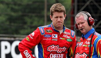 LONG POND, PA - JUNE 11: Carl Edwards, driver of the #99 Kellogg / Cheez-it Ford waits with Crew Chief Bob Osborne during qualifying for the NASCAR Sprint Cup Series 5-Hour Energy 500 at Pocono Raceway on June 11, 2011 in Long Pond, Pennsylvania.  (Photo 
