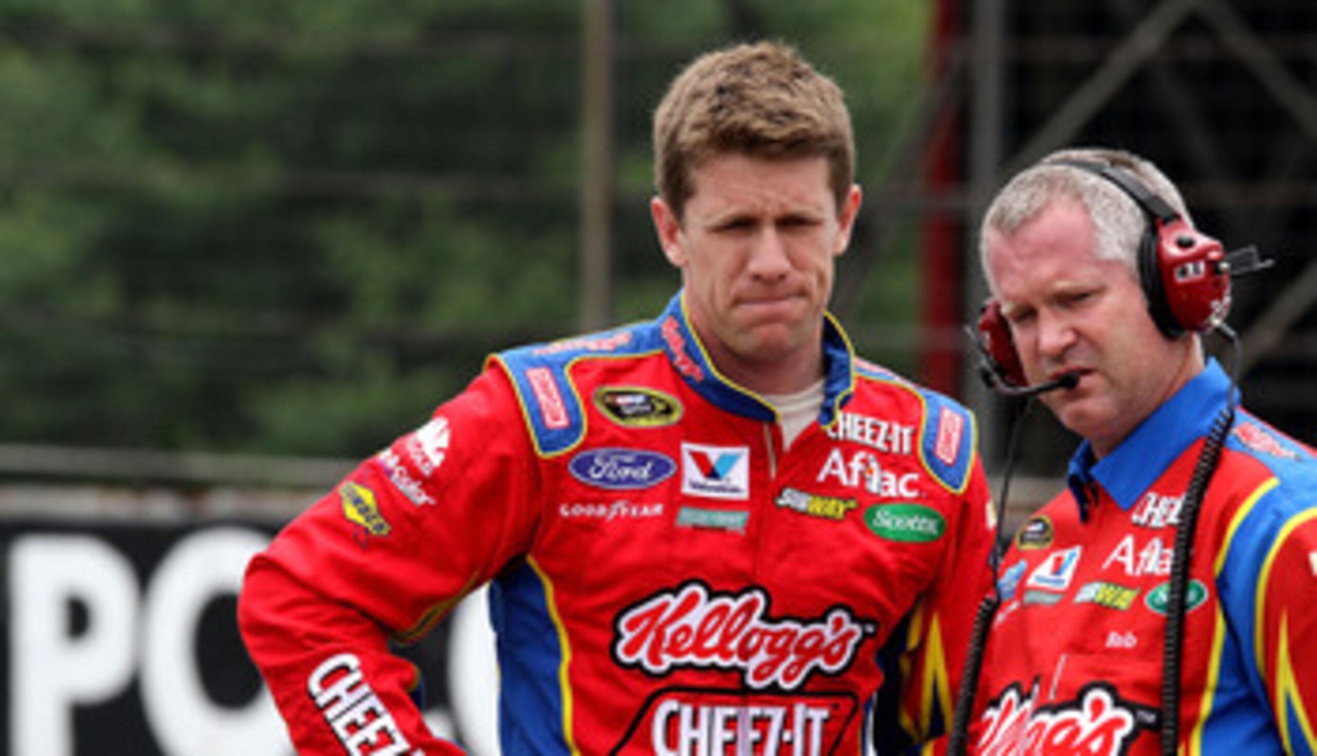 LONG POND, PA - JUNE 11: Carl Edwards, driver of the #99 Kellogg / Cheez-it Ford waits with Crew Chief Bob Osborne during qualifying for the NASCAR Sprint Cup Series 5-Hour Energy 500 at Pocono Raceway on June 11, 2011 in Long Pond, Pennsylvania.  (Photo 