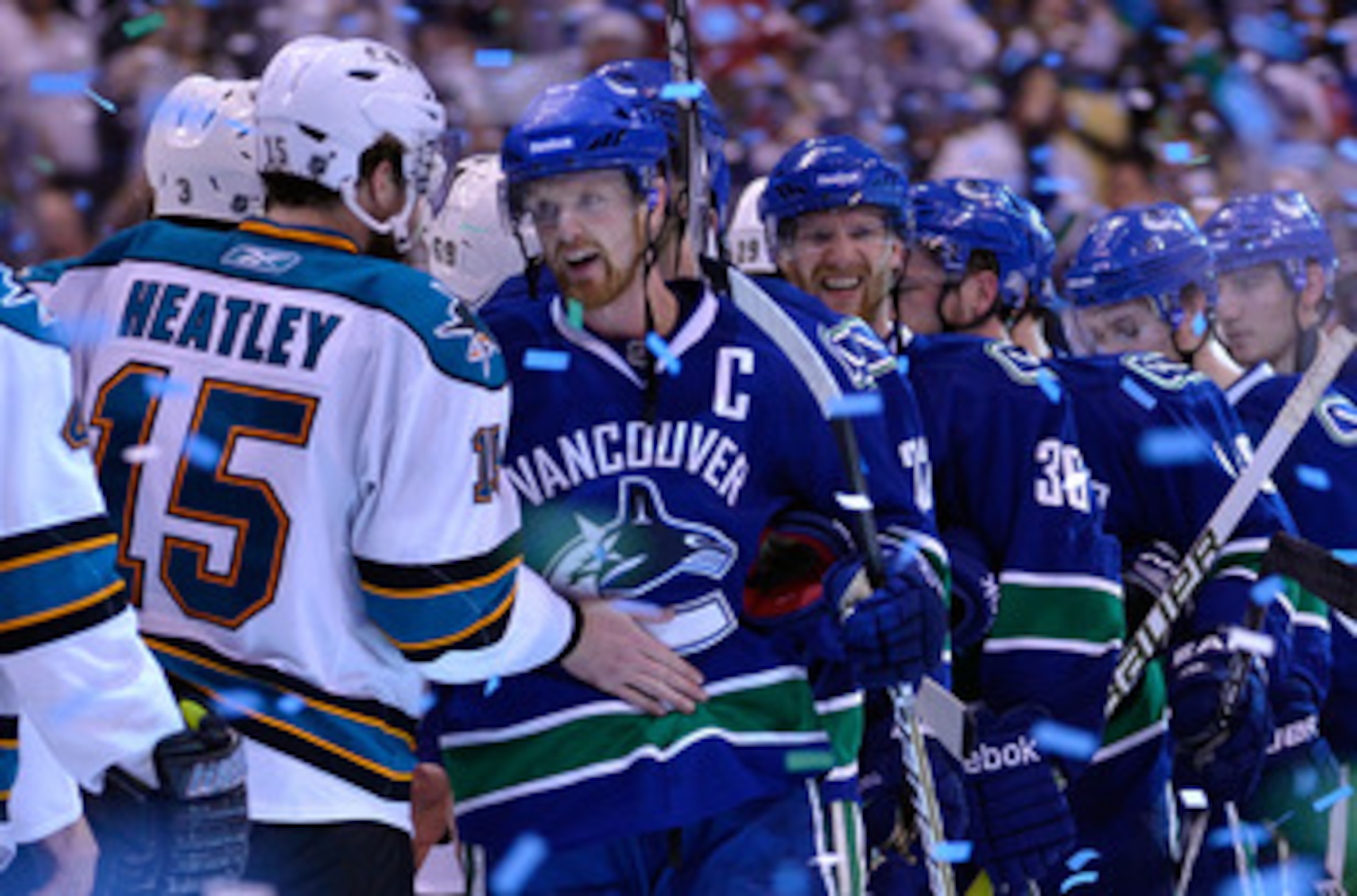 VANCOUVER, CANADA - MAY 24:  Captain Henrik Sedin #33 of the Vancouver Canucks shakes hands with Dany Heatley #15 of the San Jose Sharks after the Vancouver Canucks won Game Five of the Western Conference Finals 3-2 in the second overtime to win the serie