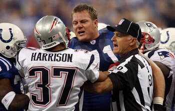 INDIANAPOLIS - NOVEMBER 04:  Line judge Gary Cavaletto #60 attempts to seperate Ryan Diem #71 of the Indianapolis Colts and Rodney Harrison #37 of the New England Patriots during the first quarter of their game on November 4, 2007 at the RCA Dome in India