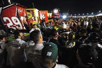 DARLINGTON, SC - MAY 07:  The #29 Budweiser Chevrolet team of Kevin Harvick and the #18 Wrigley's Doublemint Toyota team of Kyle Busch confront each other after the NASCAR Sprint Cup Series SHOWTIME Southern 500 at Darlington Raceway on May 7, 2011 in Dar