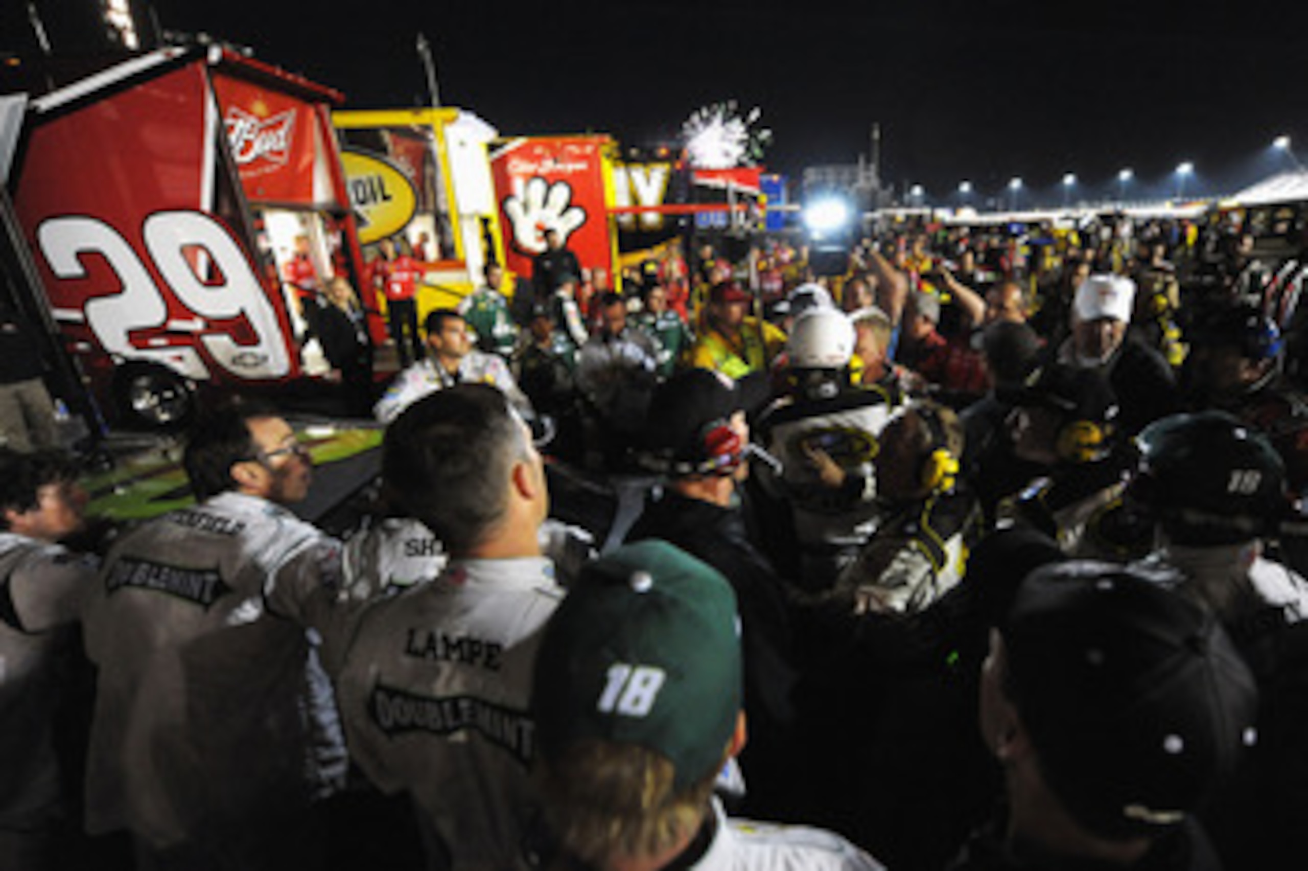 DARLINGTON, SC - MAY 07:  The #29 Budweiser Chevrolet team of Kevin Harvick and the #18 Wrigley's Doublemint Toyota team of Kyle Busch confront each other after the NASCAR Sprint Cup Series SHOWTIME Southern 500 at Darlington Raceway on May 7, 2011 in Dar