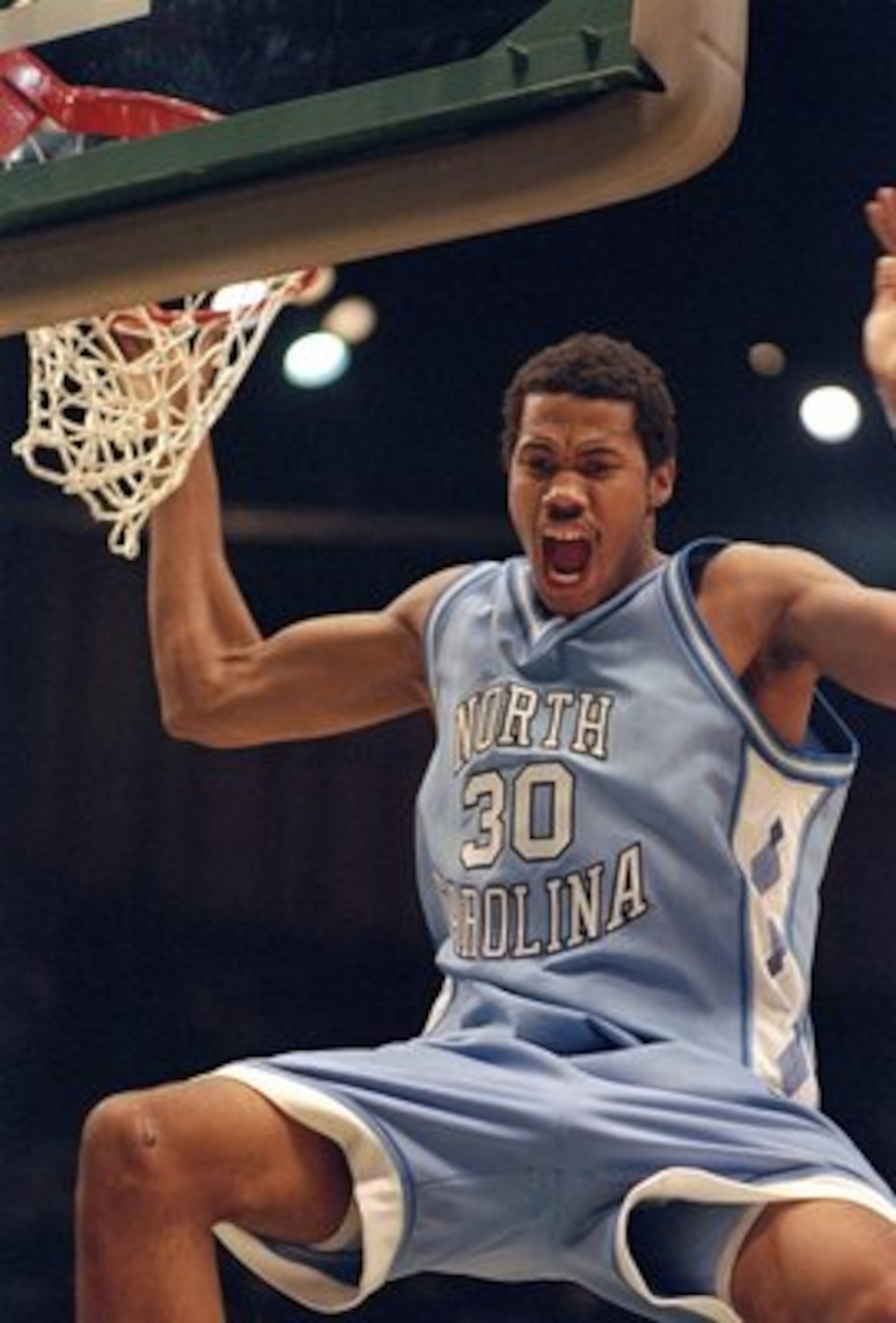 25 Mar 1995:  Center Rasheed Wallace of the North Carolina Tarheels slam dunks the ball during a playoff game against the Kent Golden Flashes.  North Carolina won the game 74-61. Mandatory Credit: Andy Lyons  /Allsport