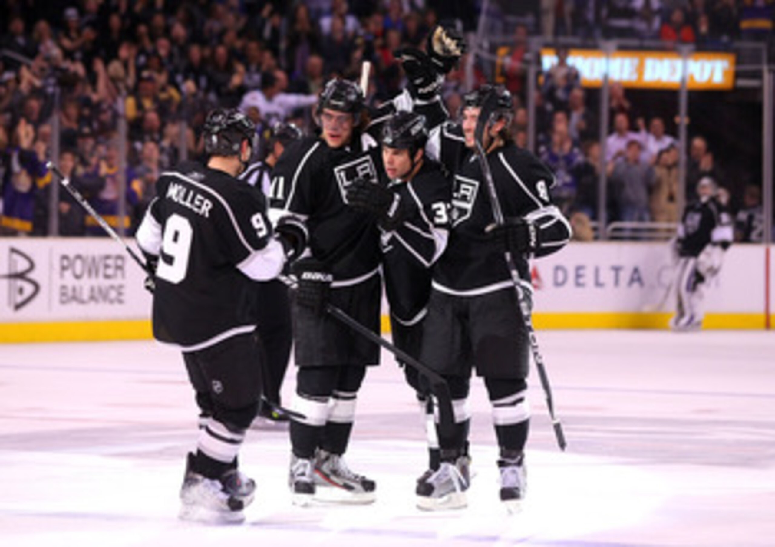 LOS ANGELES, CA - MARCH 24:  Willie Mitchell #33 of the Los Angeles Kings celebrates his goal with teammates Oscar Moller #9, Anze Kopitar #11 and Drew Doughty #8 in the second period during the NHL game against the San Jose Sharks at Staples Center on Ma