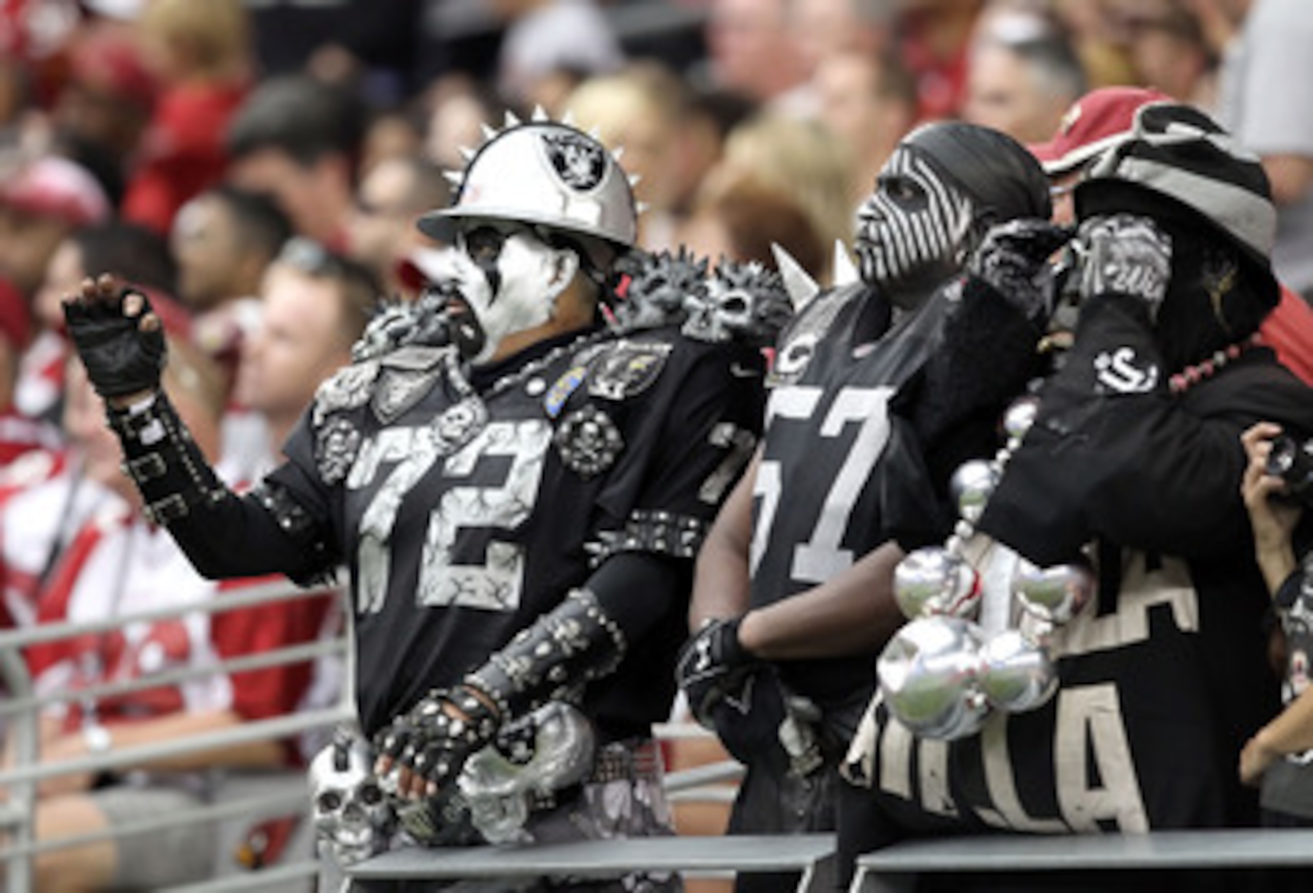 GLENDALE, AZ - SEPTEMBER 26: Fans of the Oakland Raiders cheer during the NFL game against the Arizona Cardinals at the University of Phoenix Stadium on September 26, 2010 in Glendale, Arizona. The Cardinals defeated the Raiders 24-23. (Photo by Christ GLENDALE, AZ - SEPTEMBER 26: Fans of the Oakland Raiders cheer during the NFL game against the Arizona Cardinals at the University of Phoenix Stadium on September 26, 2010 in Glendale, Arizona. The Cardinals defeated the Raiders 24-23. (Photo by Christ