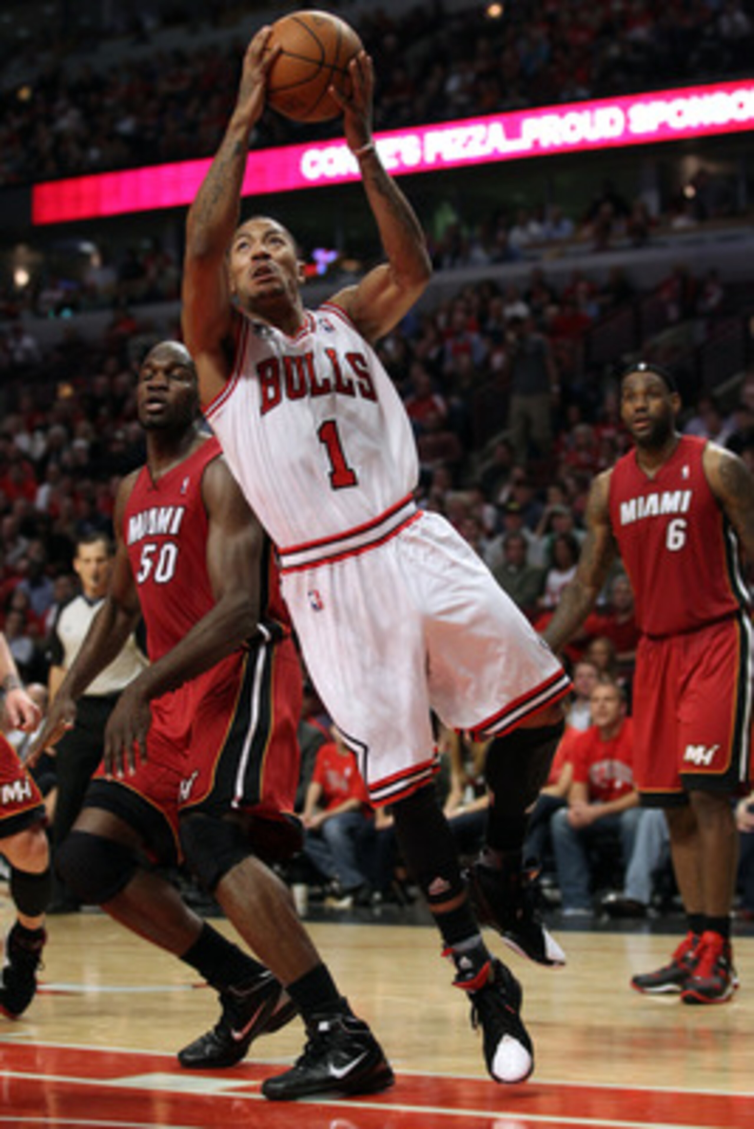 CHICAGO, IL - MAY 26:  Derrick Rose #1 of the Chicago Bulls drives for a shot attempt against the Miami Heat in Game Five of the Eastern Conference Finals during the 2011 NBA Playoffs on May 26, 2011 at the United Center in Chicago, Illinois. NOTE TO USER