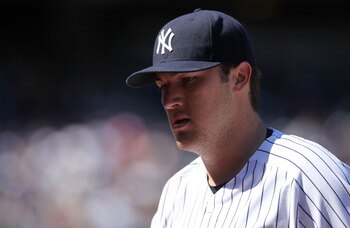 NEW YORK, NY - APRIL 03:  Phil Hughes #65 of the New York Yankees walks to the dugout against the Detroit Tigers at Yankee Stadium on April 3, 2011 in the Bronx borough of New York City.  (Photo by Nick Laham/Getty Images)