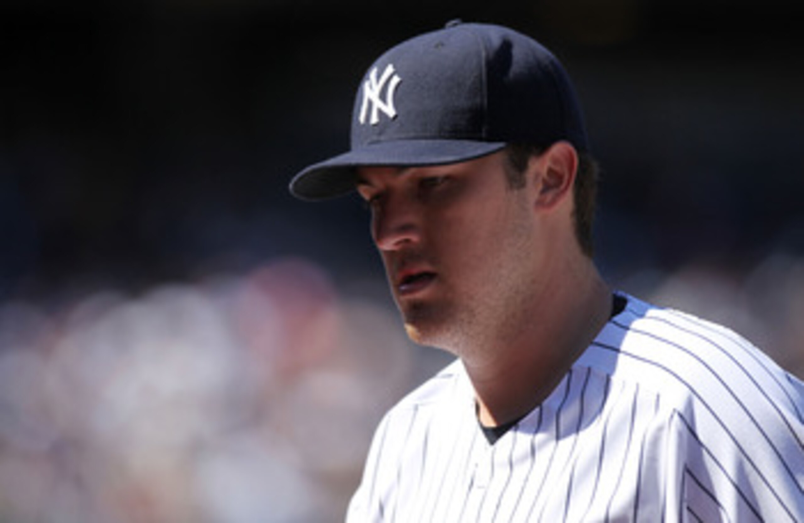 NEW YORK, NY - APRIL 03:  Phil Hughes #65 of the New York Yankees walks to the dugout against the Detroit Tigers at Yankee Stadium on April 3, 2011 in the Bronx borough of New York City.  (Photo by Nick Laham/Getty Images)