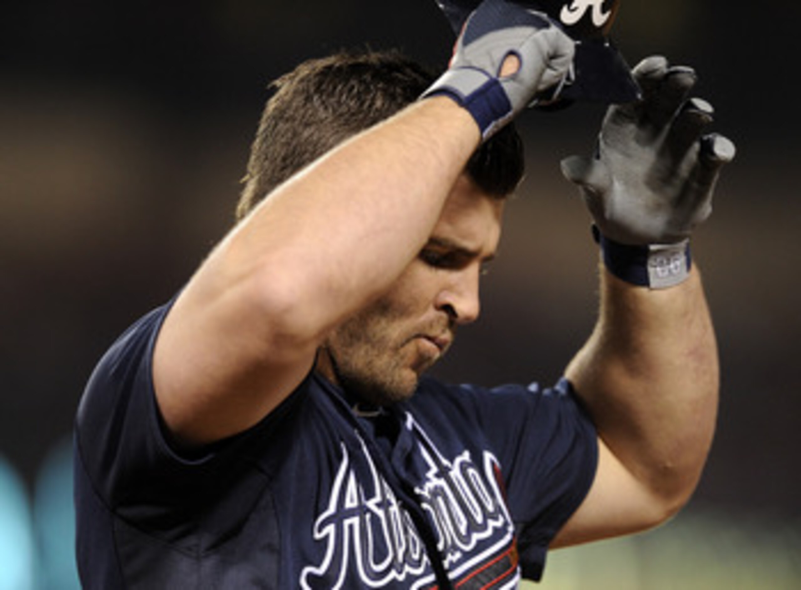 ANAHEIM, CA - MAY 21:  Dan Uggla #26 of the Atlanta Braves reacts as he grounds out with men in scoring position against the Los Angeles Angels during the sixth inning at Angel Stadium on May 21, 2011 in Anaheim, California.  (Photo by Harry How/Getty Ima