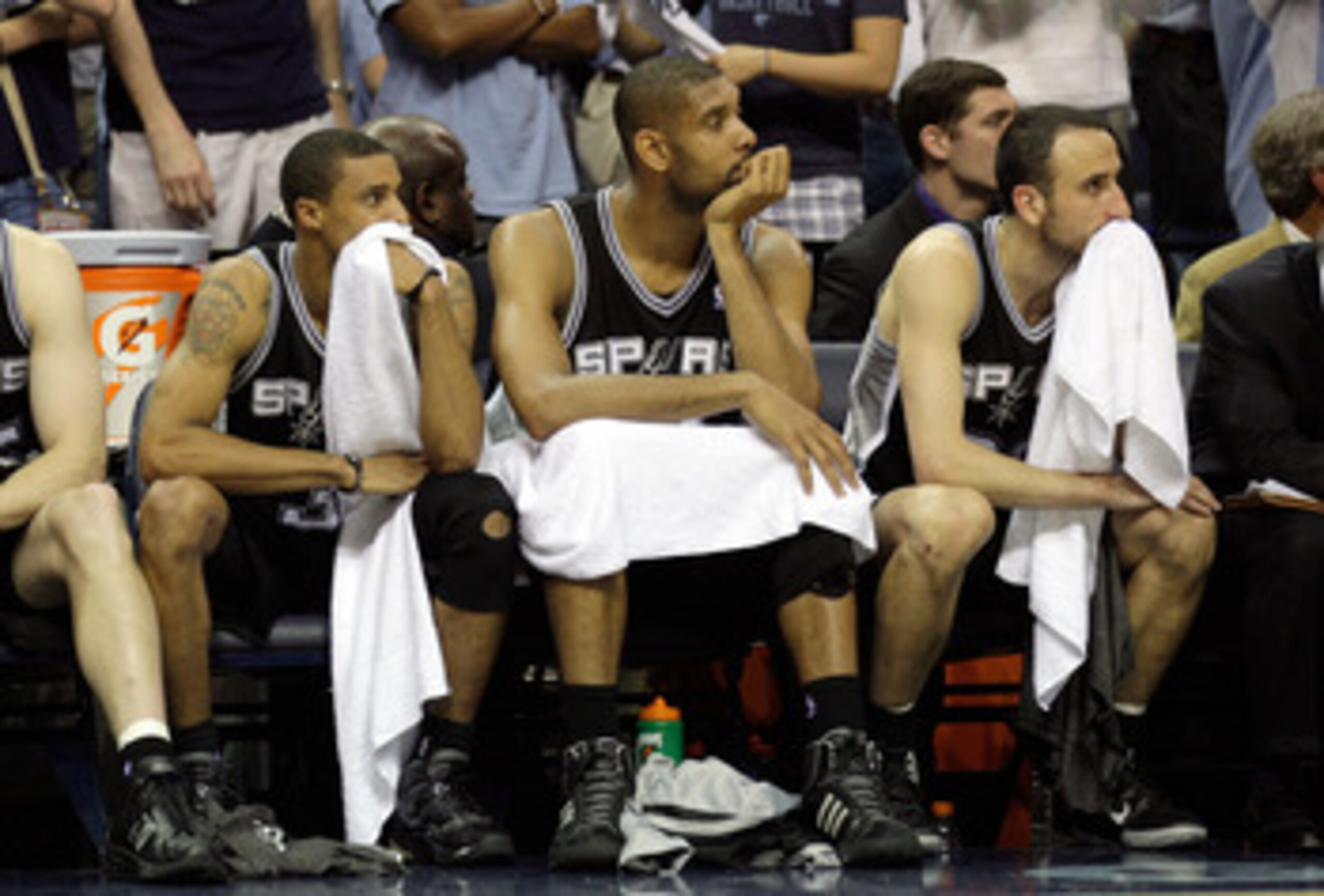 MEMPHIS, TN - APRIL 25: George Hill #3, Tim Duncan #21 and Manu Ginobili #20 of the San Antonio Spurs watch from the bench in the fourth quarter during the game against the Memphis Grizzlies in Game Four of the Western Conference Quarterfinals in the 2011 MEMPHIS, TN - APRIL 25: George Hill #3, Tim Duncan #21 and Manu Ginobili #20 of the San Antonio Spurs watch from the bench in the fourth quarter during the game against the Memphis Grizzlies in Game Four of the Western Conference Quarterfinals in the 2011