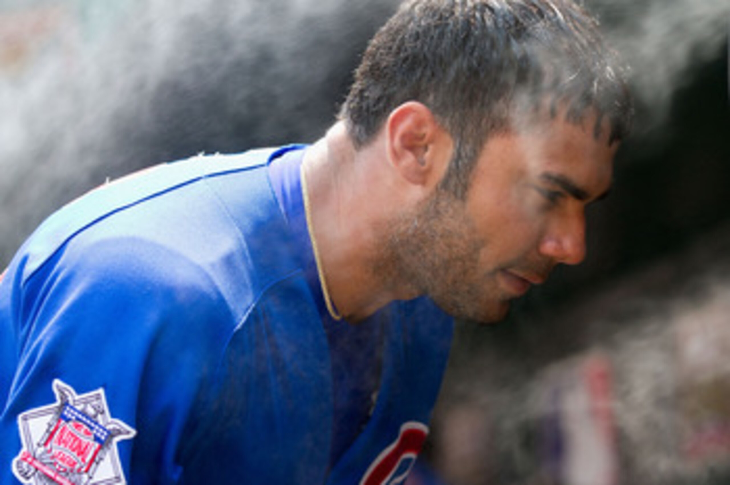 ST. LOUIS, MO - JUNE 5: Carlos Pena #22 of the Chicago Cubs cools off in the dugout against the St. Louis Cardinals at Busch Stadium on June 5, 2011 in St. Louis, Missouri.  The Cardinals beat the Cubs 3-2 in 10 innings.  (Photo by Dilip Vishwanat/Getty I