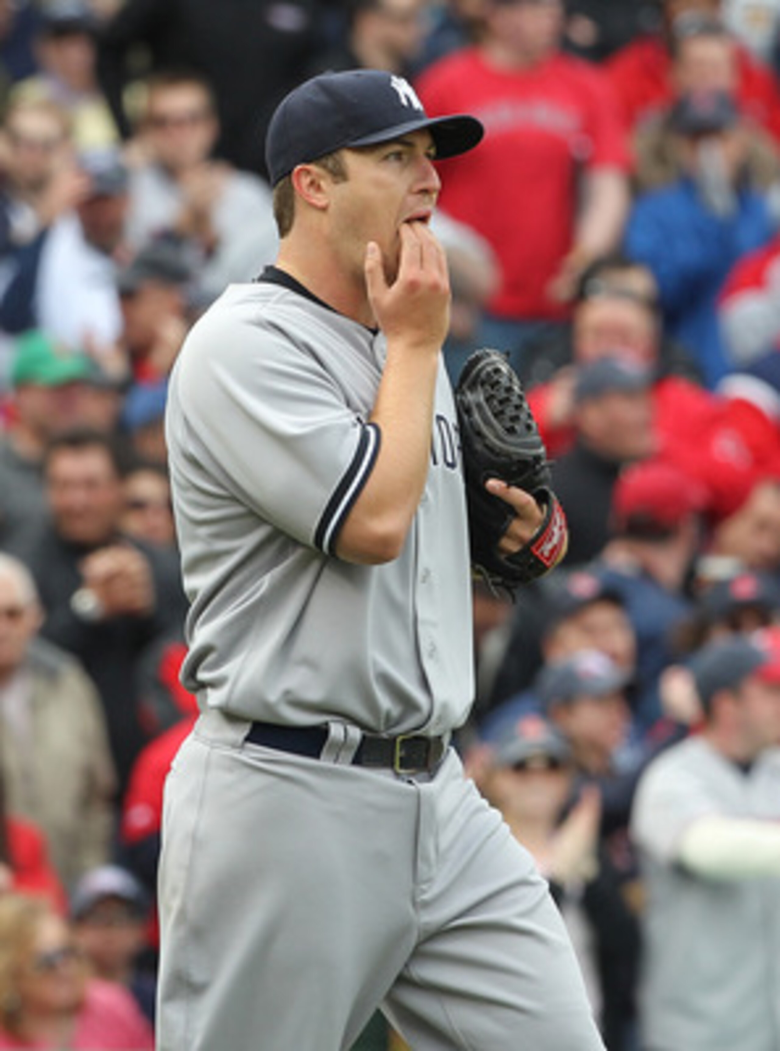 BOSTON, MA - APRIL 8:  Phil Hughes #65 of  the New York Yankees reacts during a rough second inning against the Boston Red Sox on Opening Day at Fenway Park on April 8, 2011 in Boston, Massachusetts. (Photo by Jim Rogash/Getty Images)