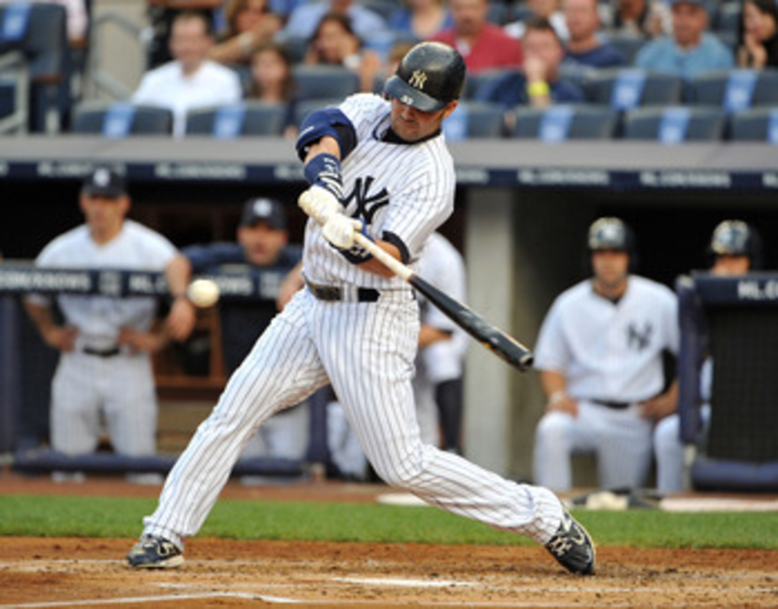 NEW YORK, NY - JUNE 10: Nick Swisher #33 of the New York Yankees connects for an RBI sacrifice fly in the bottom of the first inning against the Cleveland Indians on June 10, 2011 at Yankee Stadium in the Bronx borough of New York City. (Photo by Christop