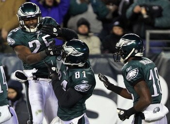 PHILADELPHIA, PA - JANUARY 09:  LeSean McCoy #25, Jason Avant #81 and Jeremy Maclin #18 of the Philadelphia Eagles celebrates Avant's third quarter touchdown against the Green Bay Packers during the 2011 NFC wild card playoff game at Lincoln Financial Fie