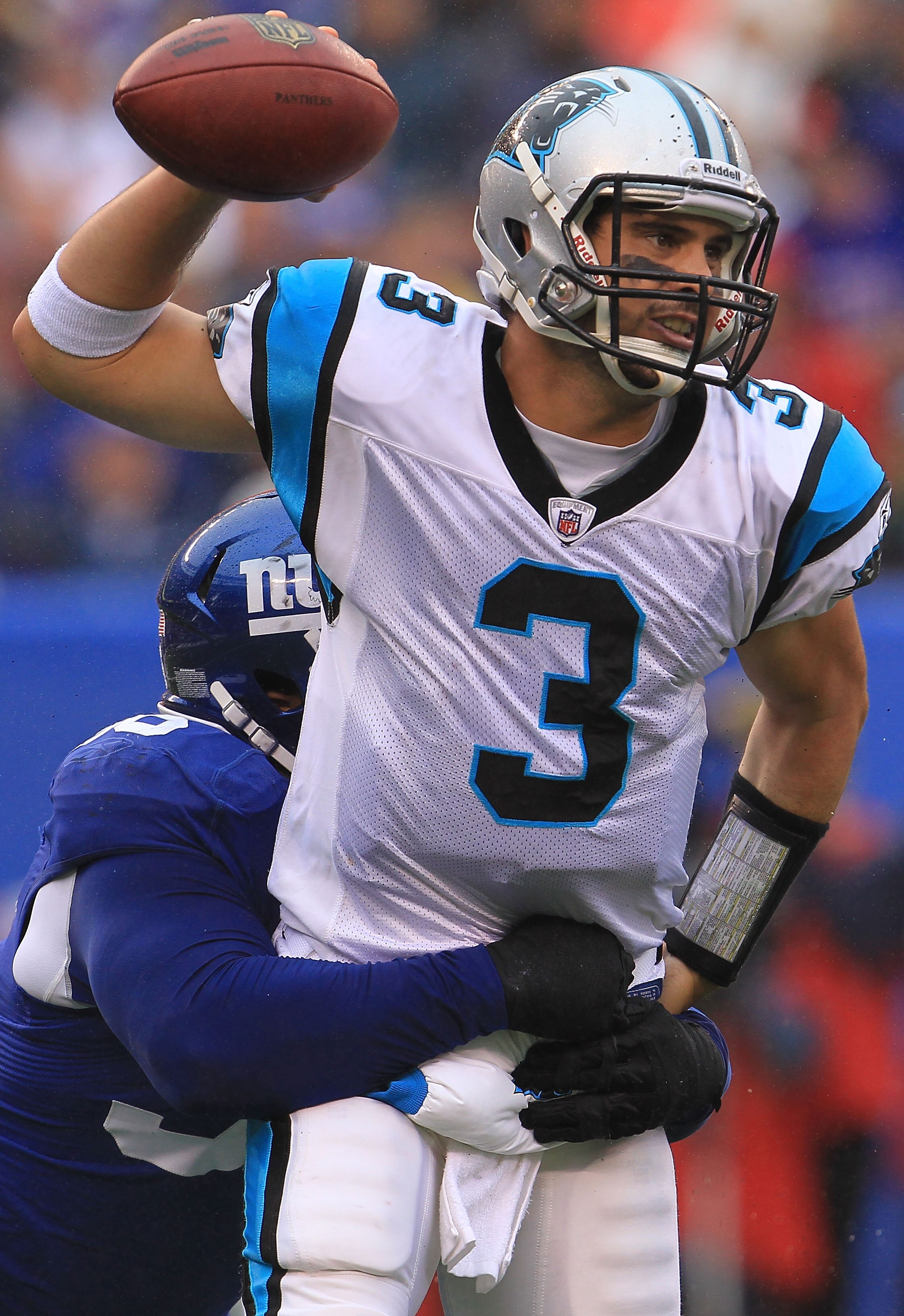 EAST RUTHERFORD, NJ - SEPTEMBER 12: Matt Moore #3 of the Carolina Panthers is sacked by Barry Cofield #96 of the New York Giants during the NFL season opener at New Meadowlands Stadium on September 12, 2010 in East Rutherford, New Jersey.  (Photo by Chris