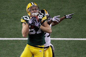ARLINGTON, TX - FEBRUARY 06:  Jordy Nelson #87 of the Green Bay Packers catches a 29 yard touchdown pass over William Gay #22 of the Pittsburgh Steelers during the first quarter of Super Bowl XLV at Cowboys Stadium on February 6, 2011 in Arlington, Texas.