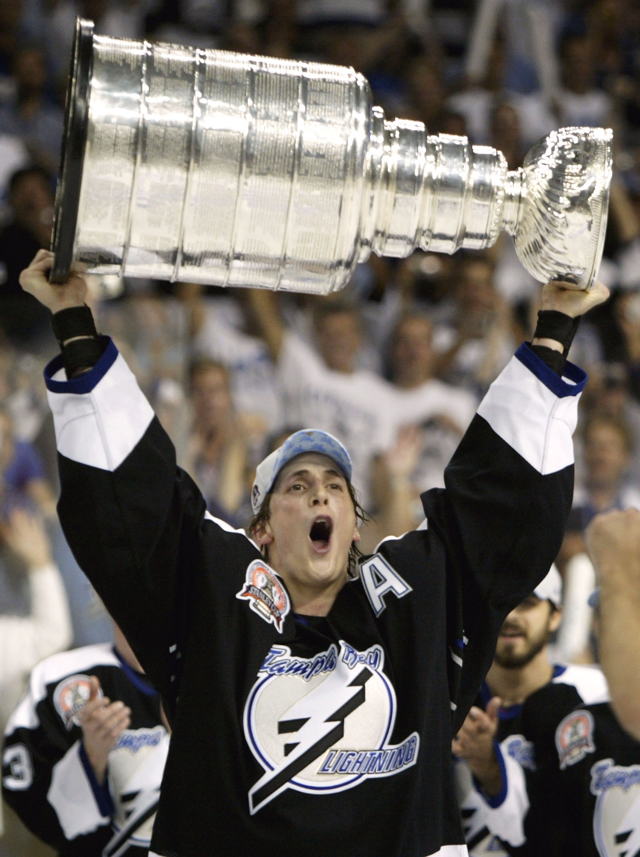 TAMPA, FL - JUNE 7:   Vincent Lecavalier #4 of the Tampa Bay Lightning skates with the Stanley Cup after defeating the Calgary Flames in game seven of the NHL Stanley Cup Finals on June 7, 2004 at the St. Pete Times Forum in Tampa, Florida. The Lightning