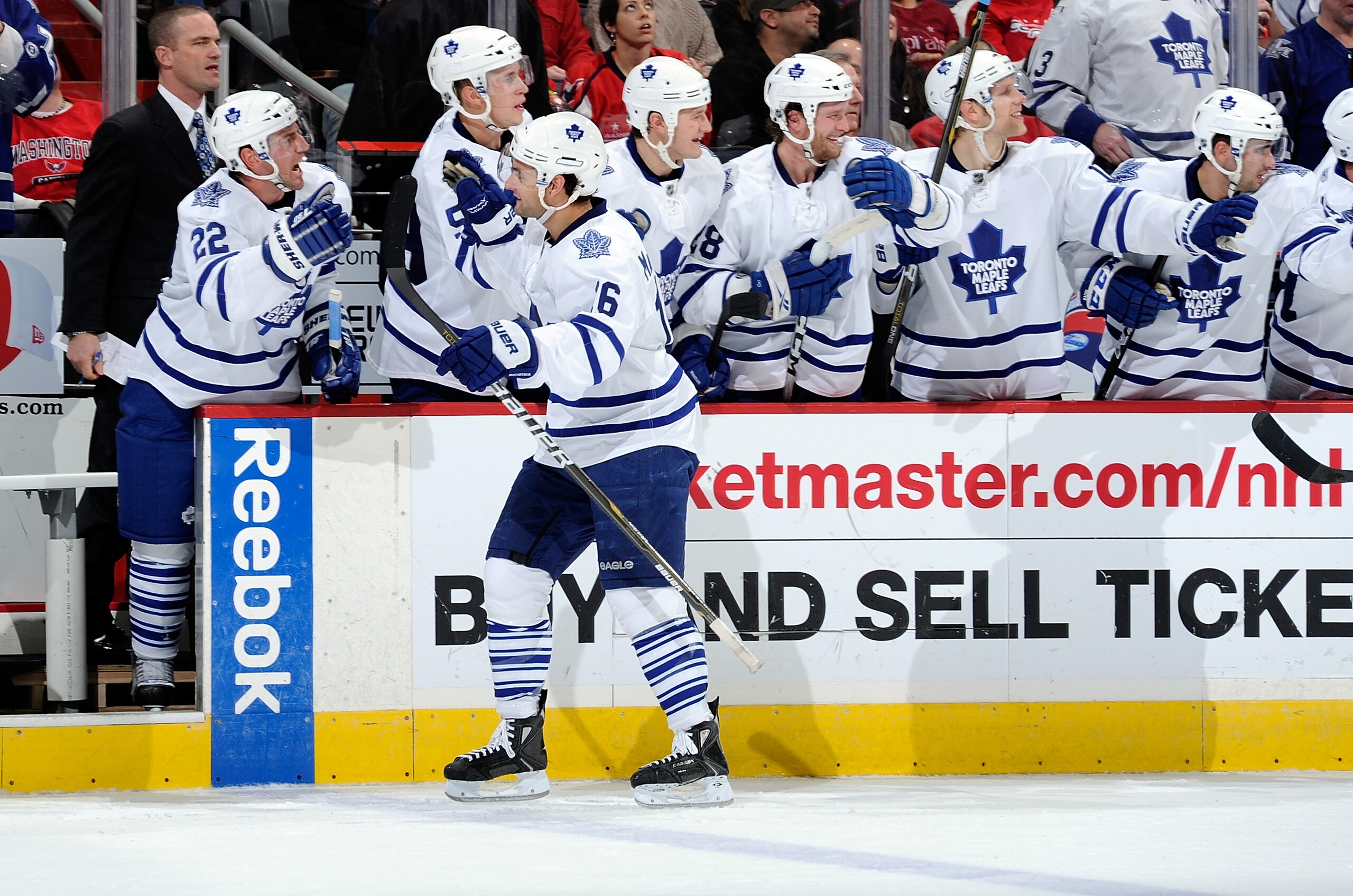 WASHINGTON - DECEMBER 06:  Clarke MacArthur #16 of the Toronto Maple Leafs celebrates with teammates after scoring in the third period against the Washington Capitals at the Verizon Center on December 6, 2010 in Washington, DC.  (Photo by Greg Fiume/Getty