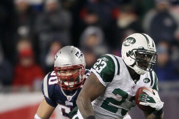 FOXBORO, MA - JANUARY 16:  Runningback Shonn Greene #23 of the New York Jets runs with the ball against the New England Patriots during their 2011 AFC divisional playoff game at Gillette Stadium on January 16, 2011 in Foxboro, Massachusetts.  (Photo by El