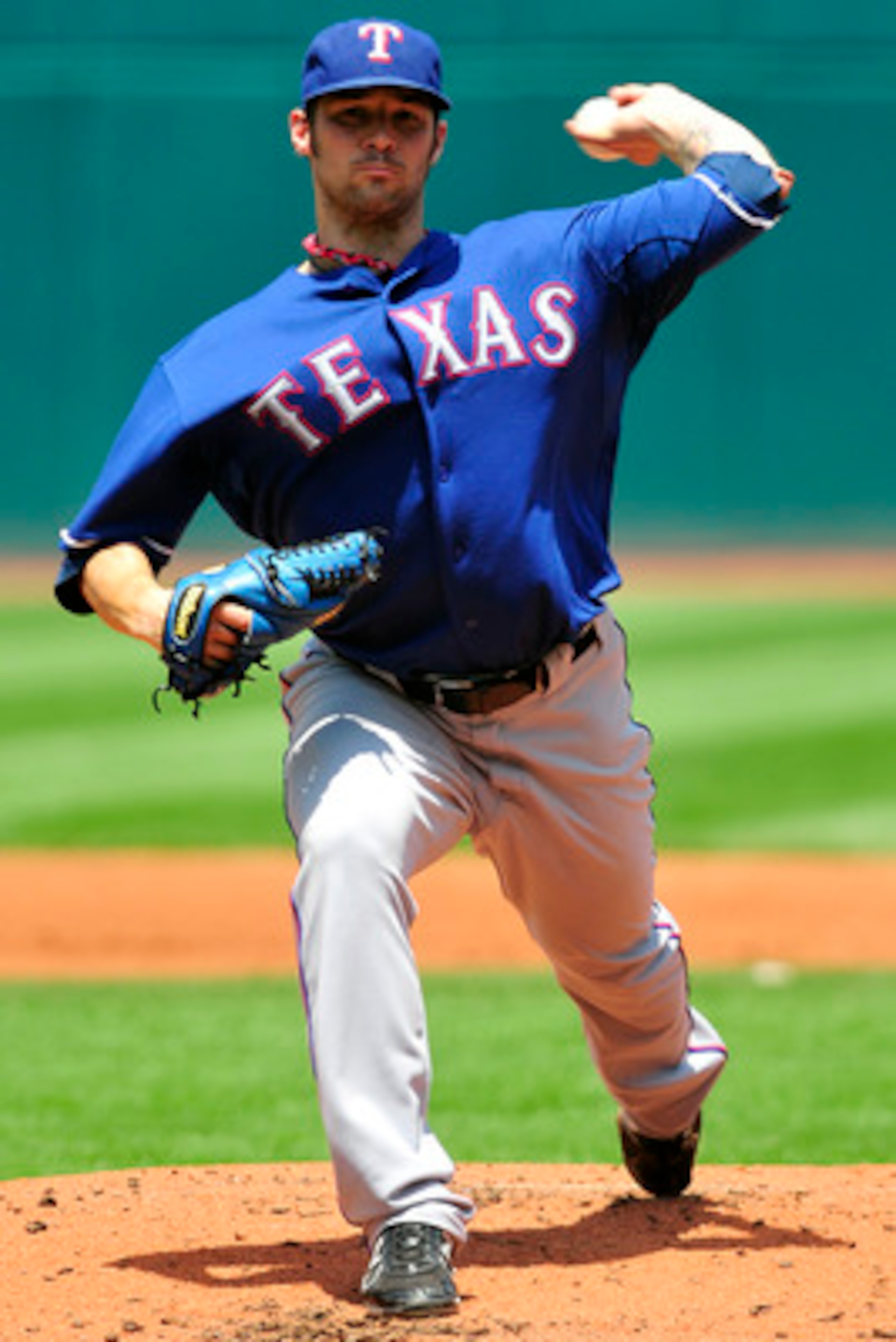 CLEVELAND, OH - JUNE 5: C.J. Wilson #36 of the Texas Rangers pitches during the second inning against the Cleveland Indians at Progressive Field on June 5, 2011 in Cleveland, Ohio. (Photo by Jason Miller/Getty Images)