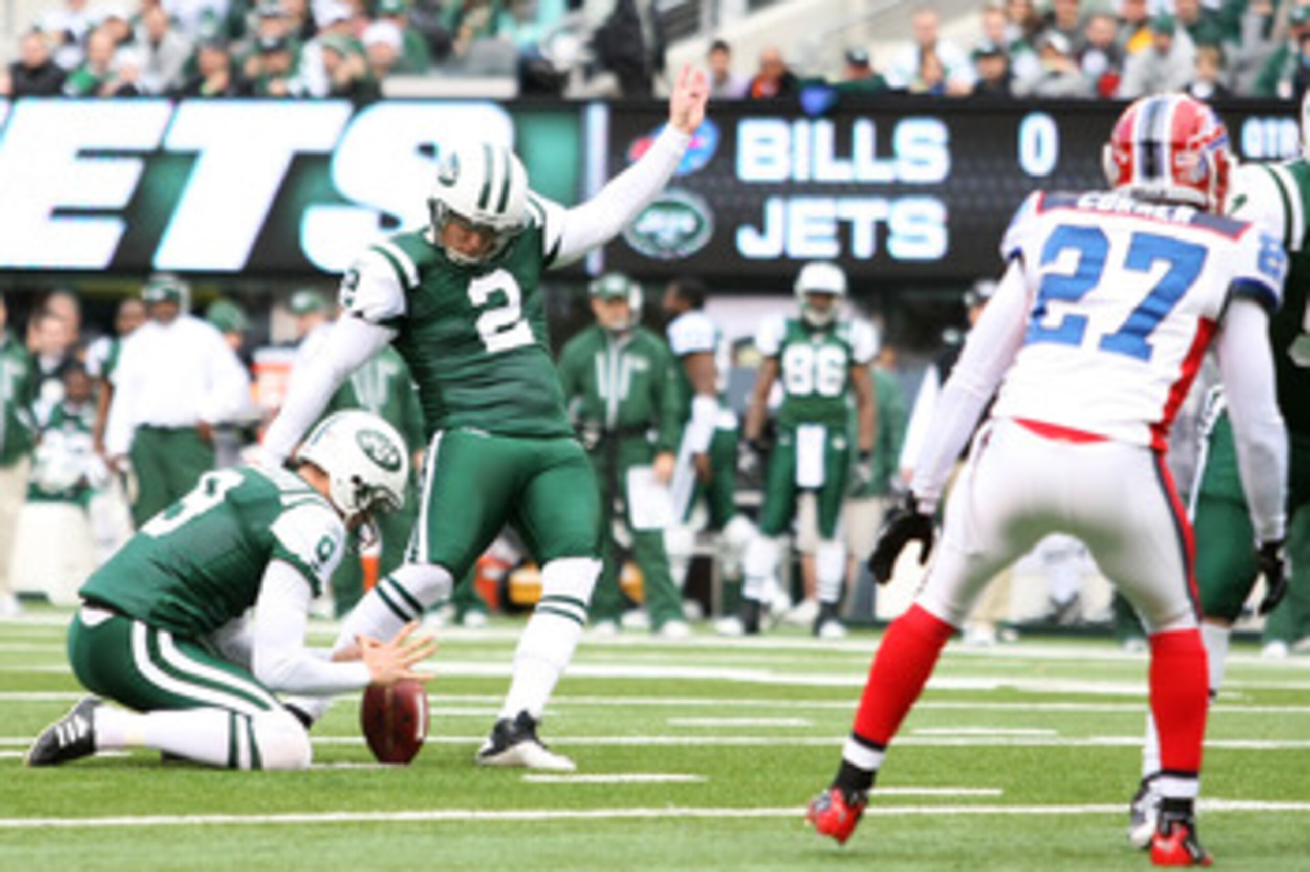 EAST RUTHERFORD, NJ - JANUARY 02:  Nick Folk #2 kicks as Steve Weatherford #9 of the New York Jets holds against the Buffalo Bills at New Meadowlands Stadium on January 2, 2011 in East Rutherford, New Jersey.  (Photo by Michael Heiman/Getty Images)