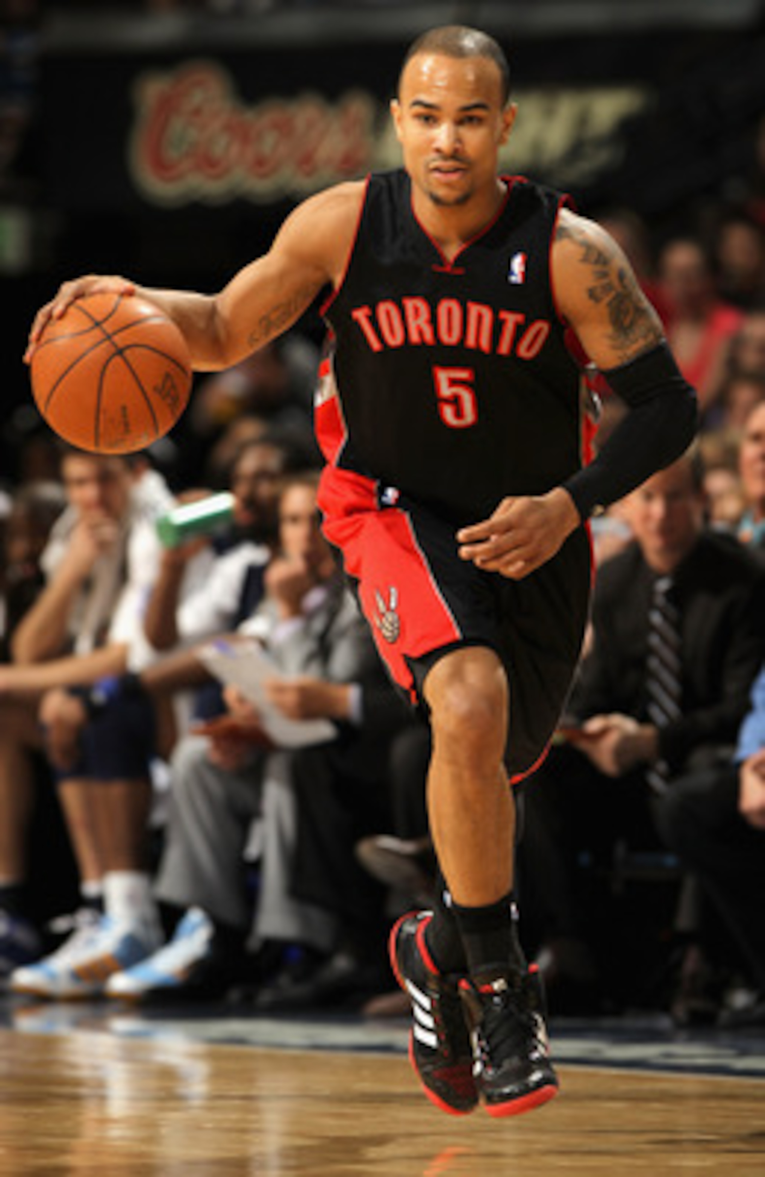 DENVER, CO - MARCH 21:  Jerryd Bayless #5 of the Toronto Raptors controls the ball against the Denver Nuggets at the Pepsi Center on March 21, 2011 in Denver, Colorado. The Nuggets defeated the Raptors 123-90. NOTE TO USER: User expressly acknowledges and