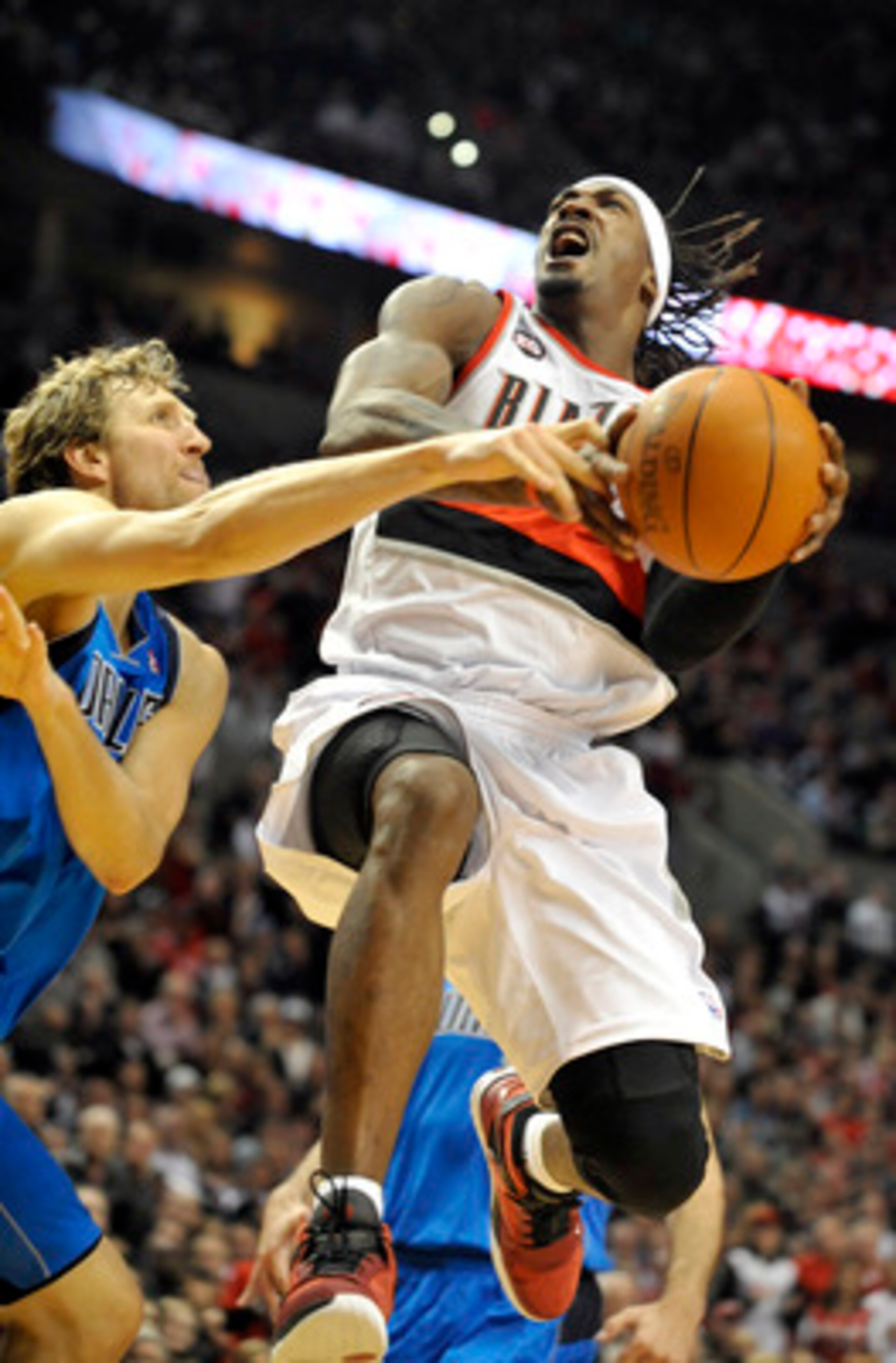 PORTLAND, OR - APRIL 28: Gerald Wallace #3 of the Portland Trail Blazers is fouled by Dirk Nowitzki #41 of the Dallas Mavericks during the fourth quarter of Game Six of the Western Conference Quartefinals in the 2011 NBA Playsoffs on April 28, 2011 at the