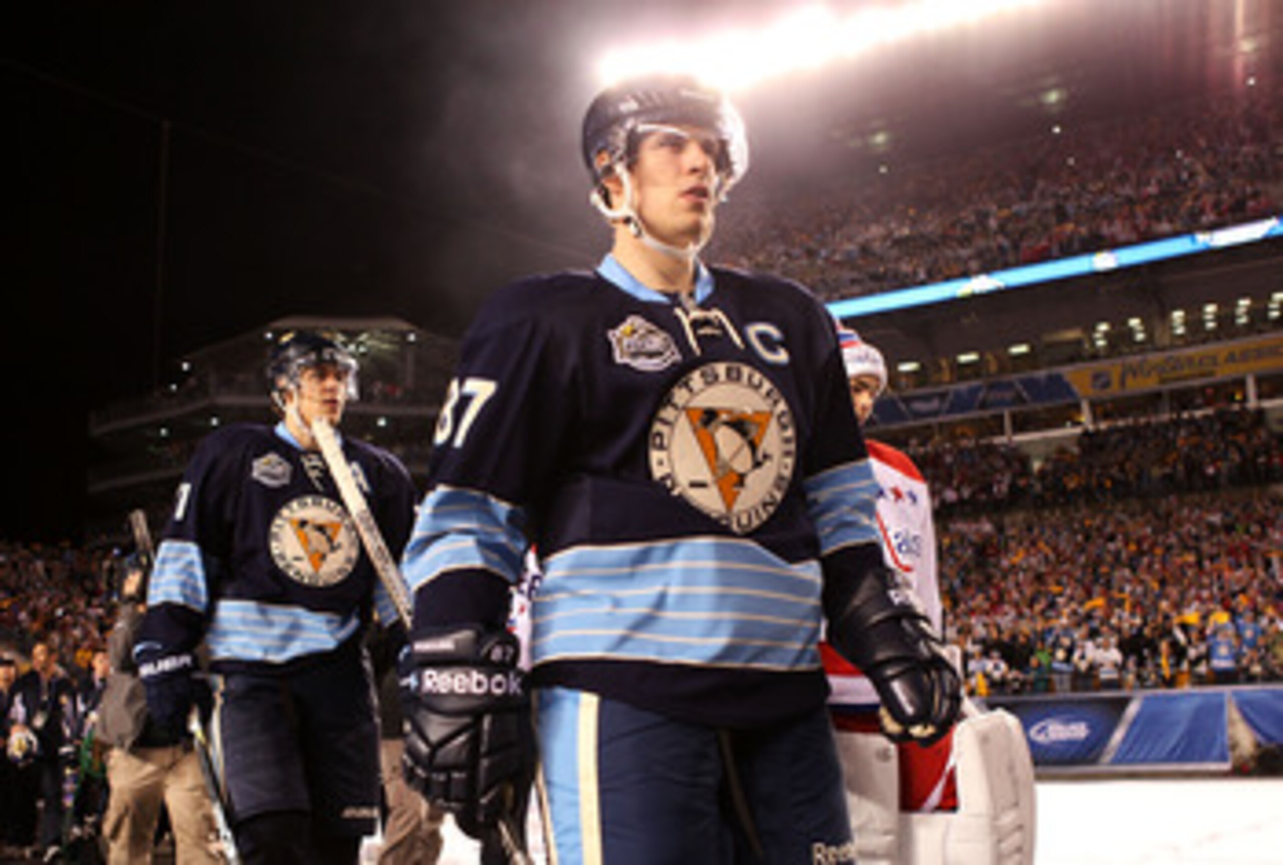 PITTSBURGH, PA - JANUARY 01:  Captain Sidney Crosby #87 of the Pittsburgh Penguins walks out to the ice before playing against the Washington Capitals duringf the 2011 NHL Bridgestone Winter Classic at Heinz Field on January 1, 2011 in Pittsburgh, Pennsyl