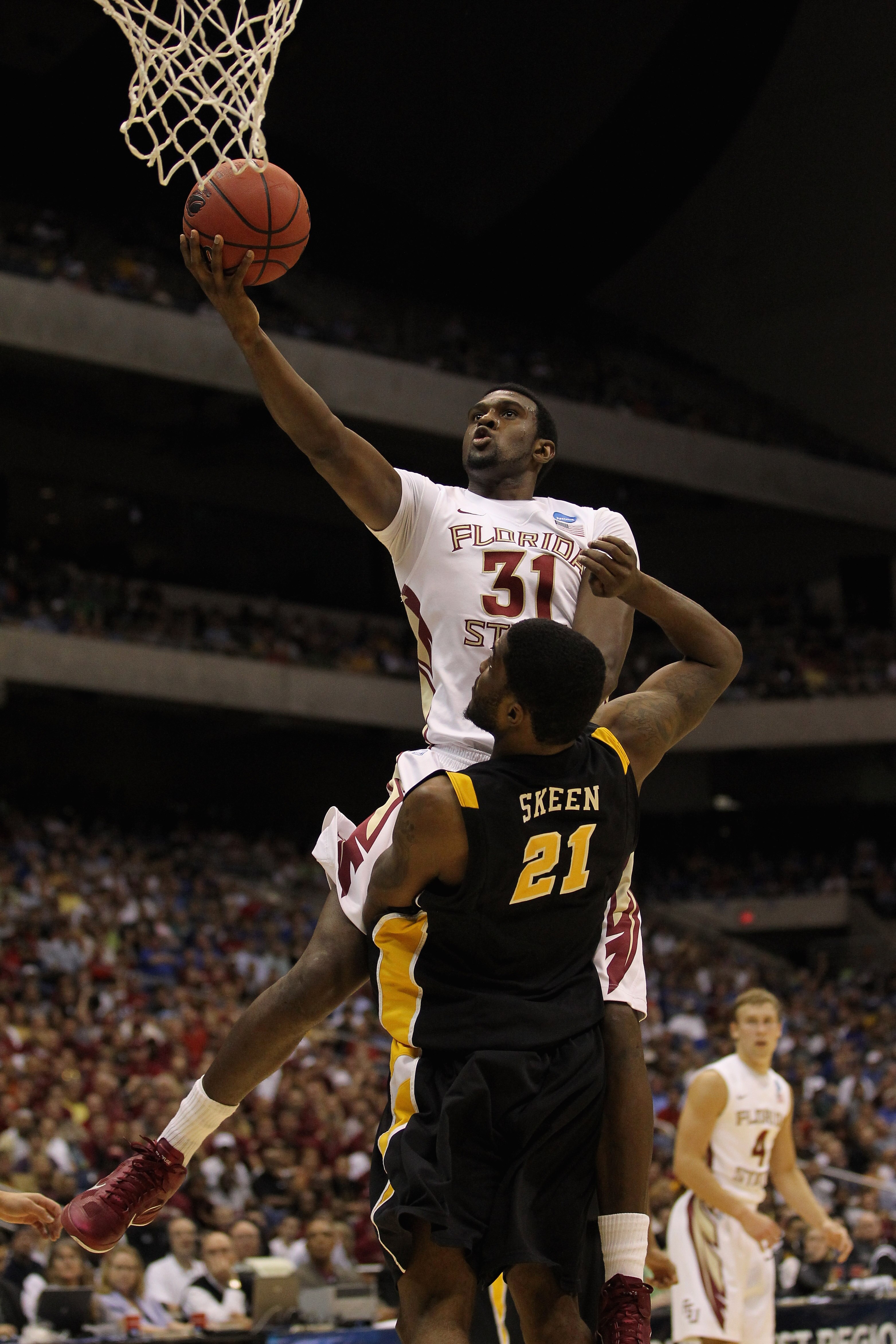 SAN ANTONIO, TX - MARCH 25:  Chris Singleton #31 of the Florida State Seminoles goes to the basket against Jamie Skeen #21 of the Virginia Commonwealth Rams during the southwest regional of the 2011 NCAA men's basketball tournament at the Alamodome on Mar