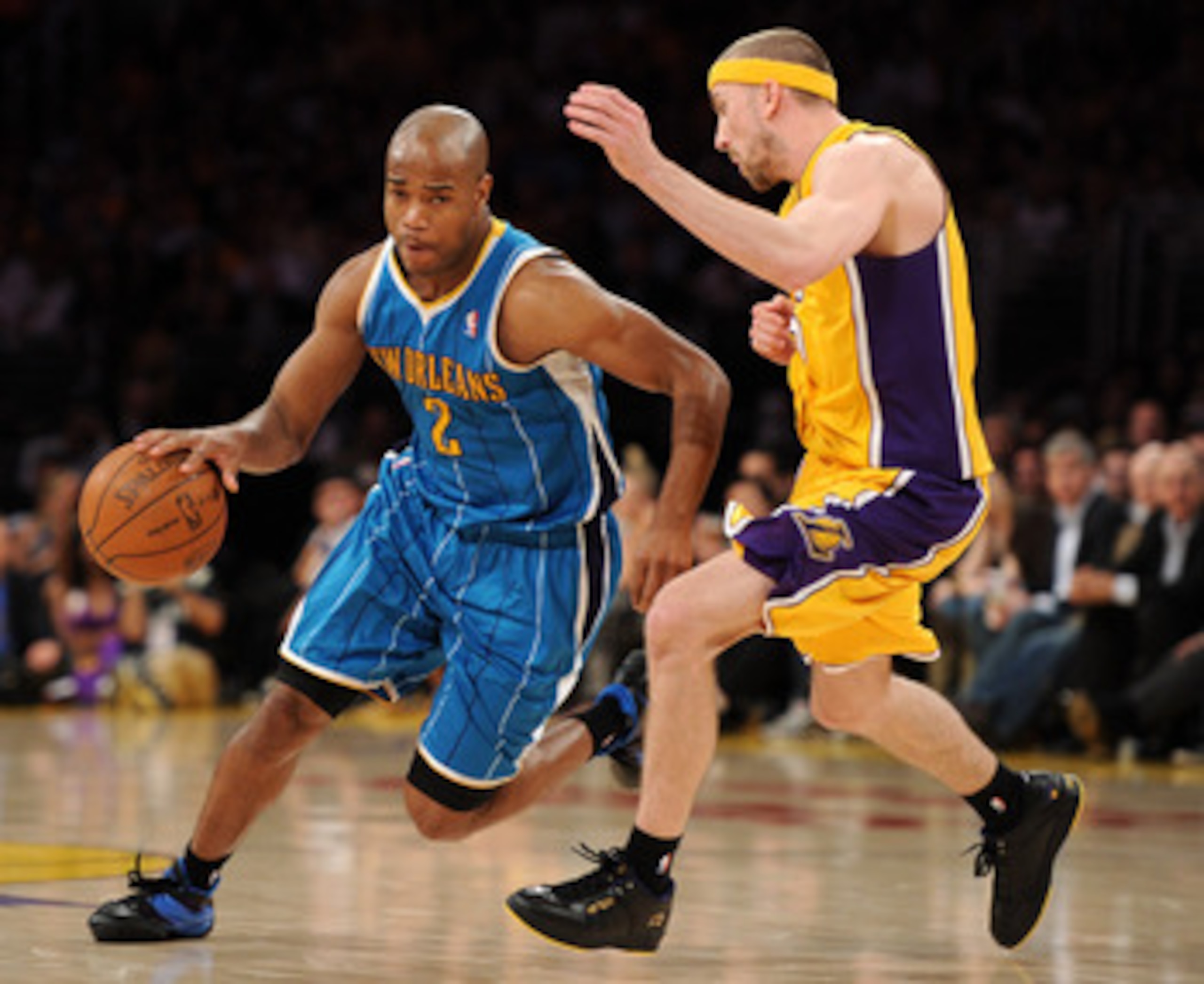 LOS ANGELES, CA - APRIL 26:  Jarrett Jack #2 of the New Orleans Hornets drives on Steve Blake #5 of the Los Angeles Lakers in Game Five of the Western Conference Quarterfinals in the 2011 NBA Playoffs on April 26, 2011 at Staples Center in Los Angeles, Ca