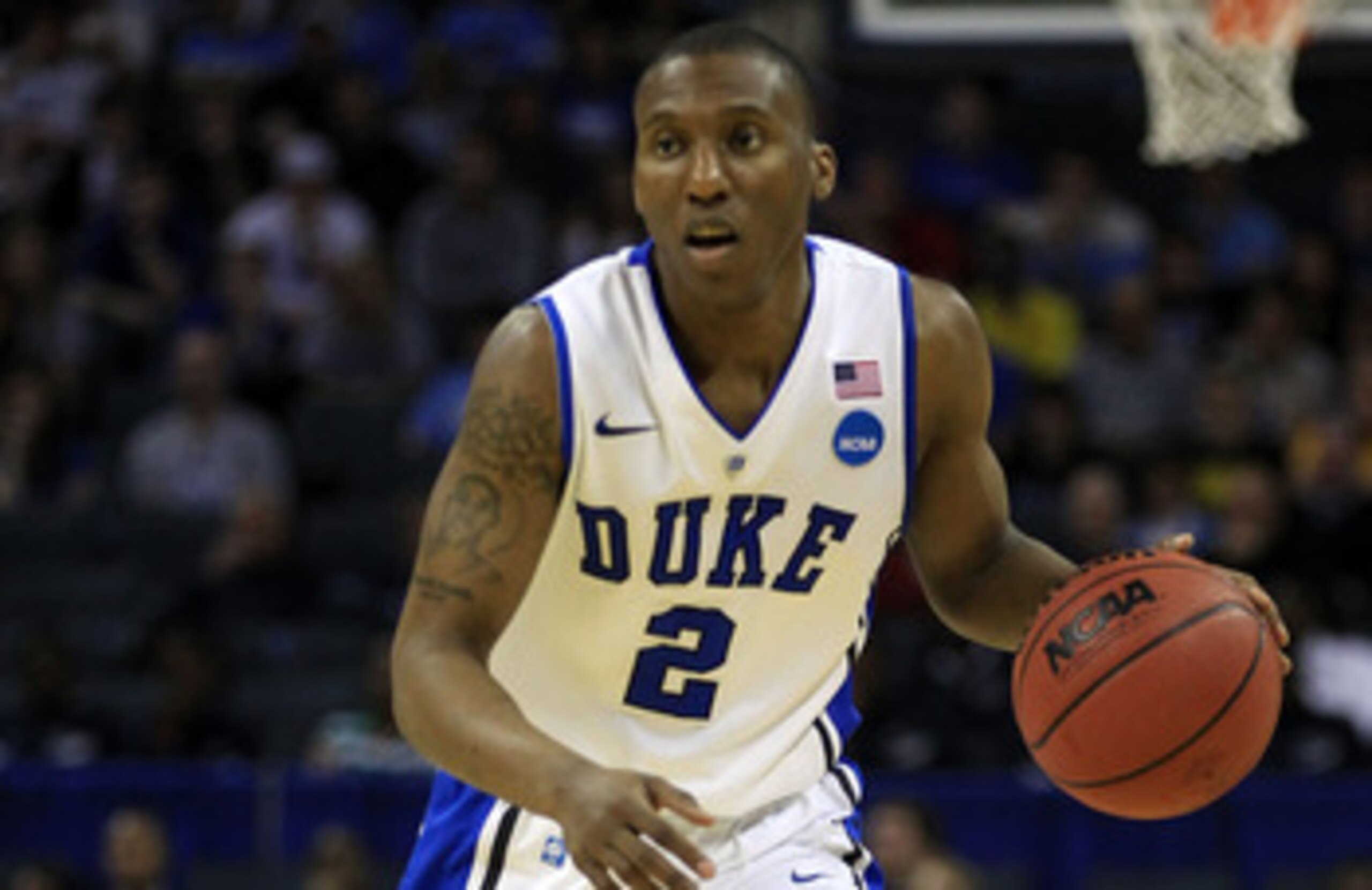 CHARLOTTE, NC - MARCH 20:  Nolan Smith #2 of the Duke Blue Devils moves the ball while taking on the Michigan Wolverines during the third round of the 2011 NCAA men's basketball tournament at Time Warner Cable Arena on March 20, 2011 in Charlotte, North C