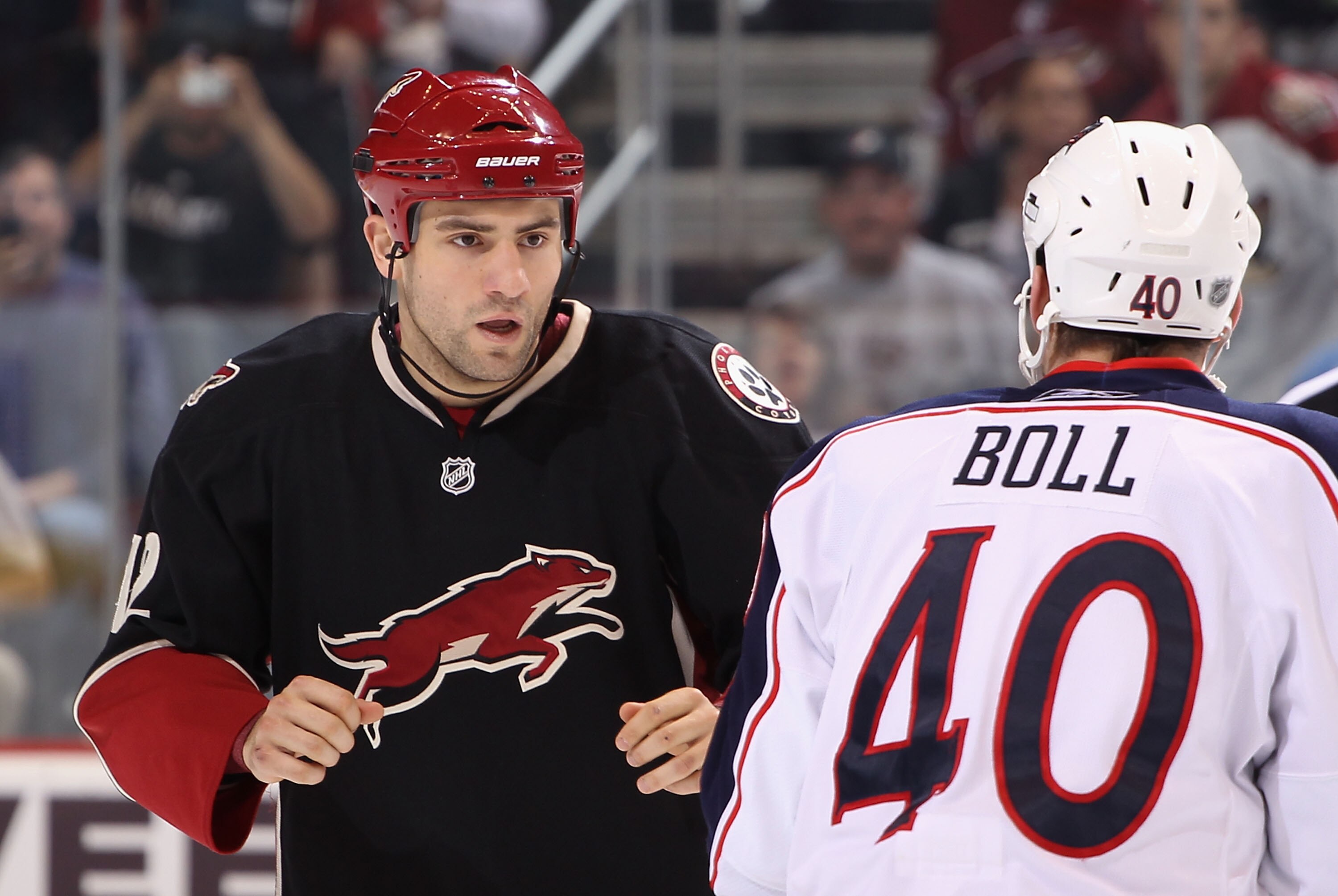 GLENDALE, AZ - MARCH 24:  Paul Bissonnette #12 of the Phoenix Coyotes fights against Jared Boll #40 of the Columbus Blue Jackets during the NHL game at Jobing.com Arena on March 24, 2011 in Glendale, Arizona.  The Coyotes defeated the Blue Jackets 3-0.  (