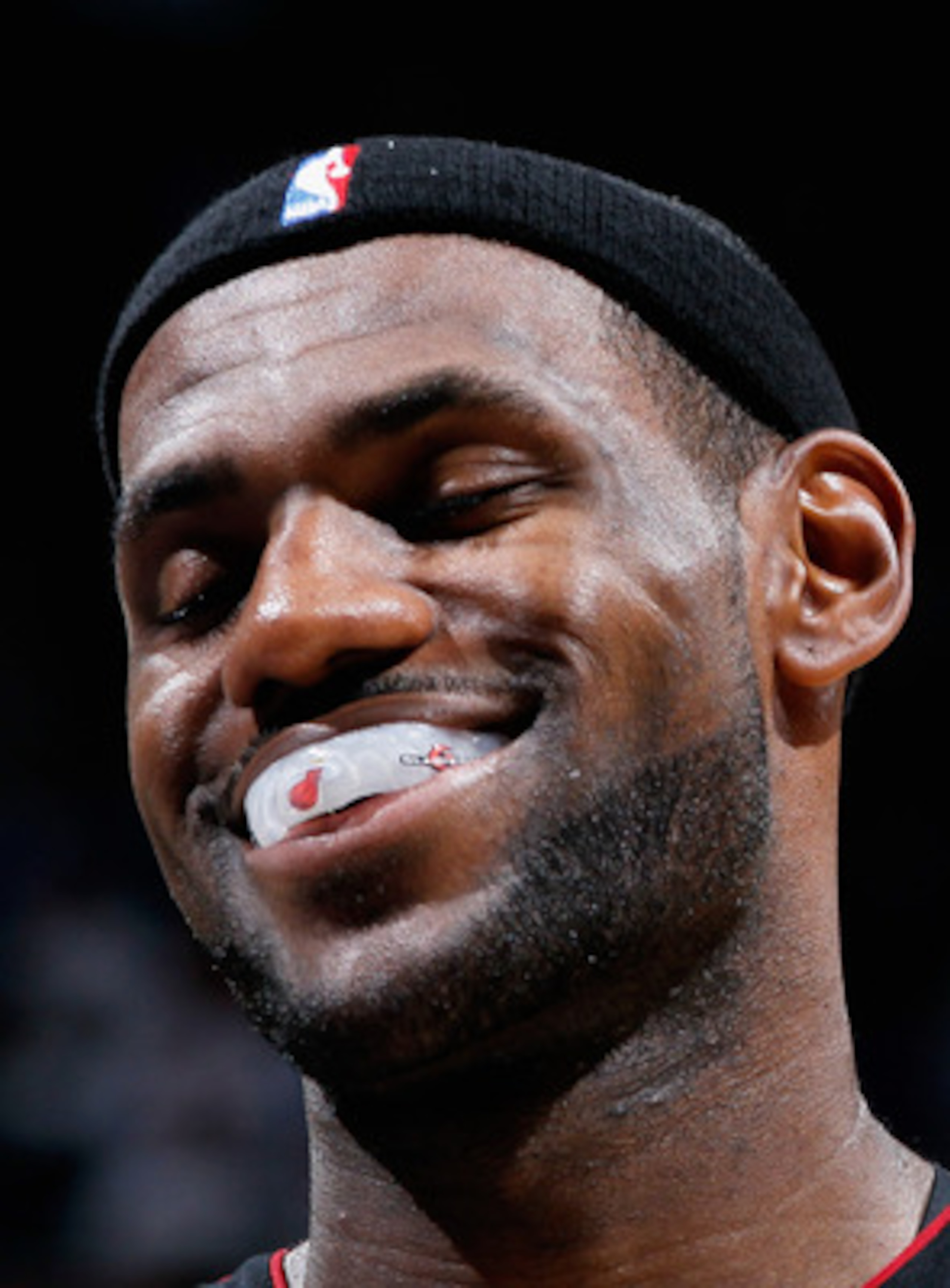 ATLANTA - OCTOBER 21:  LeBron James #6 of the Miami Heat enjoys a laugh after a timeout against the Atlanta Hawks at Philips Arena on October 21, 2010 in Atlanta, Georgia.  (Photo by Kevin C. Cox/Getty Images)