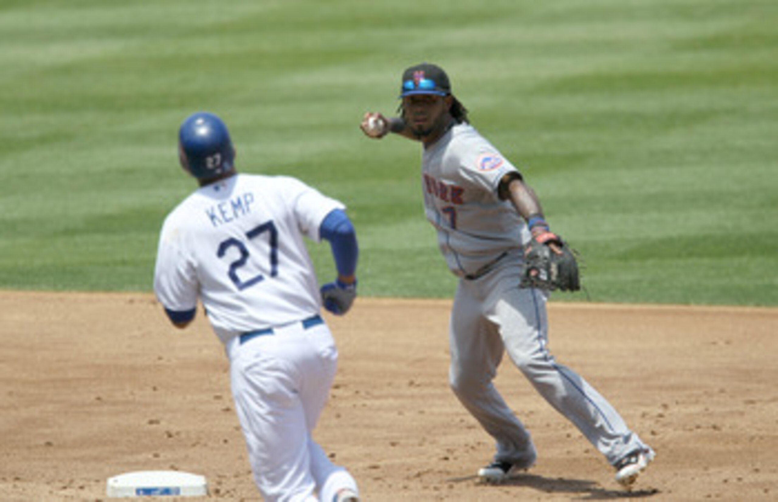 LOS ANGELES, CA - JULY 25:  Shortstop Jose Reyes #7 of the New York Mets throws to first after forcing out Matt Kemp #27 of the Los Angeles Dodgers on July 25, 2010 at Dodger Stadium in Los Angeles, California. The Dodgers won 1-0.  (Photo by Stephen Dunn