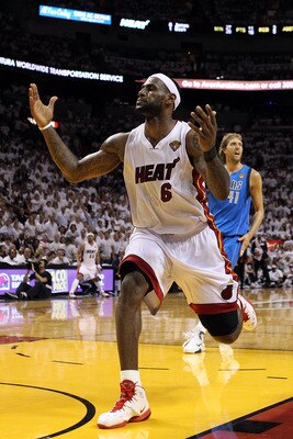 MIAMI, FL - JUNE 12:  LeBron James #6 of the Miami Heat reacts in front of Dirk Nowitzki #41 of the Dallas Mavericks in Game Six of the 2011 NBA Finals at American Airlines Arena on June 12, 2011 in Miami, Florida. NOTE TO USER: User expressly acknowledge