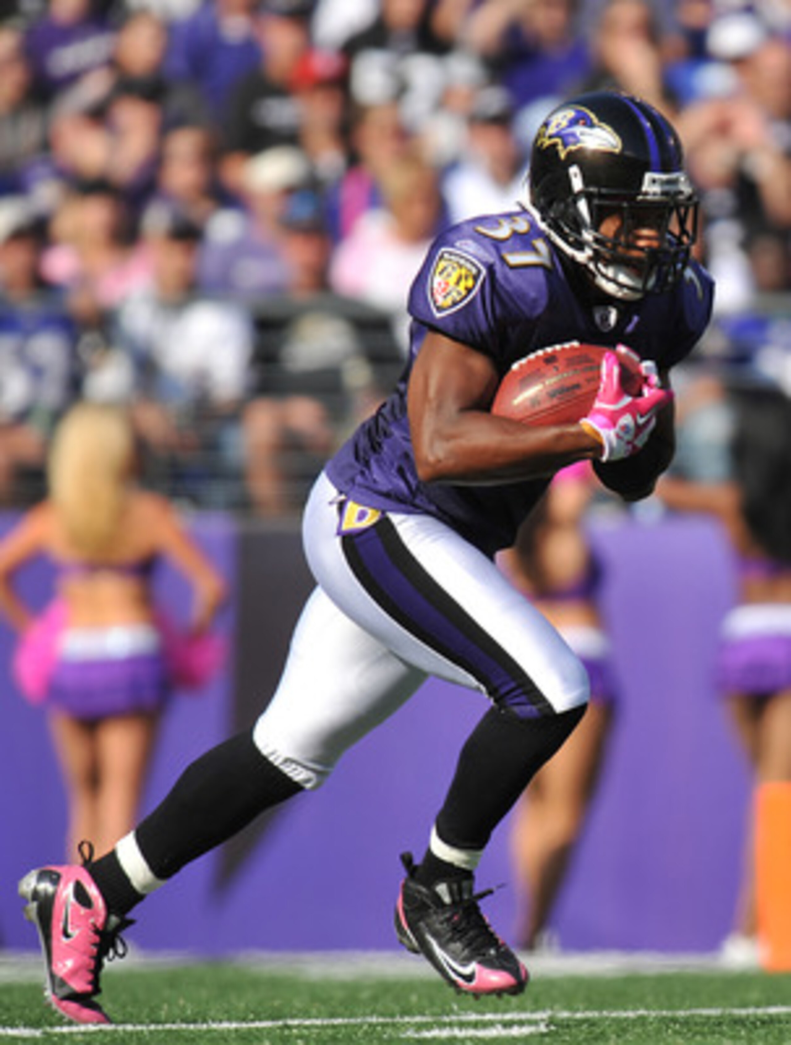 BALTIMORE, MD - OCTOBER 10: Josh Wilson #37 of the Baltimore Ravens returns a kickoff against the Denver Broncos at M&T Bank Stadium on October 10, 2010 in Baltimore, Maryland. Players wore pink in recognition of Breast Cancer Awareness Month. The Ravens 