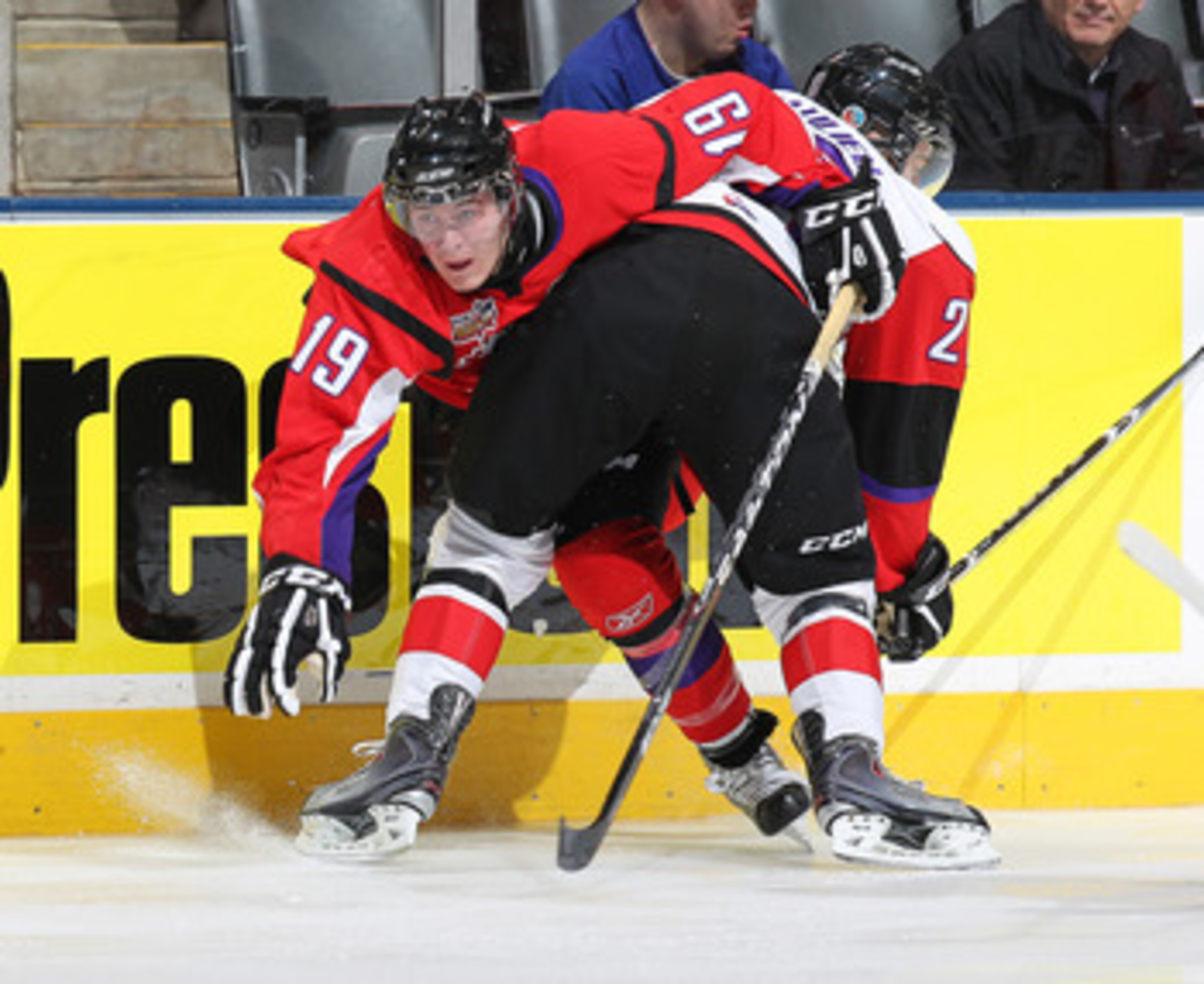 TORONTO, CANADA - JANUARY 19:  Mark Scheifele #19 of Team Cherry is pinned to the boards by Nathan Beaulieu #28 of Team Orr in the 2011 Home Hardware CHL/NHL Prospects game on January 19, 2011 at the Air Canada Centre in Toronto, Canada. (Photo by Claus A